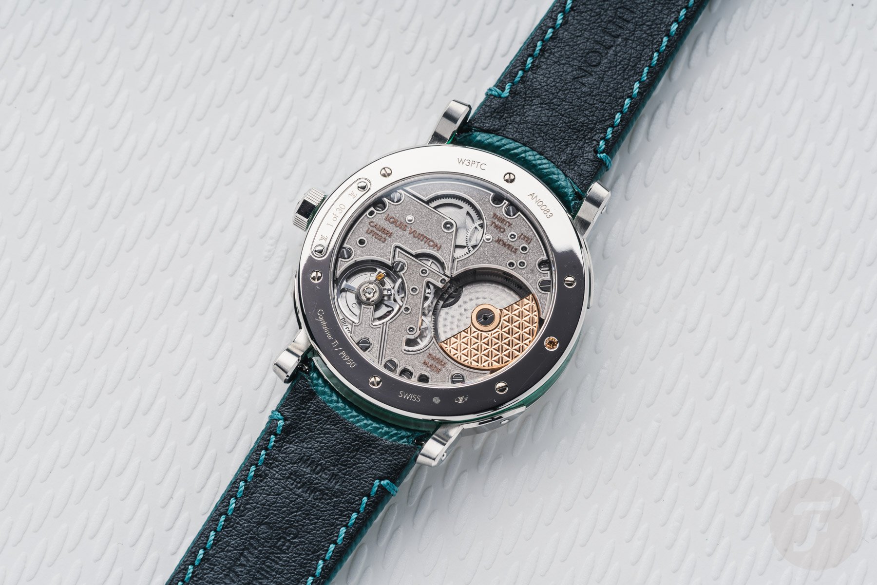 Louis Vuitton Escale Malachite face down, showing case back and movement