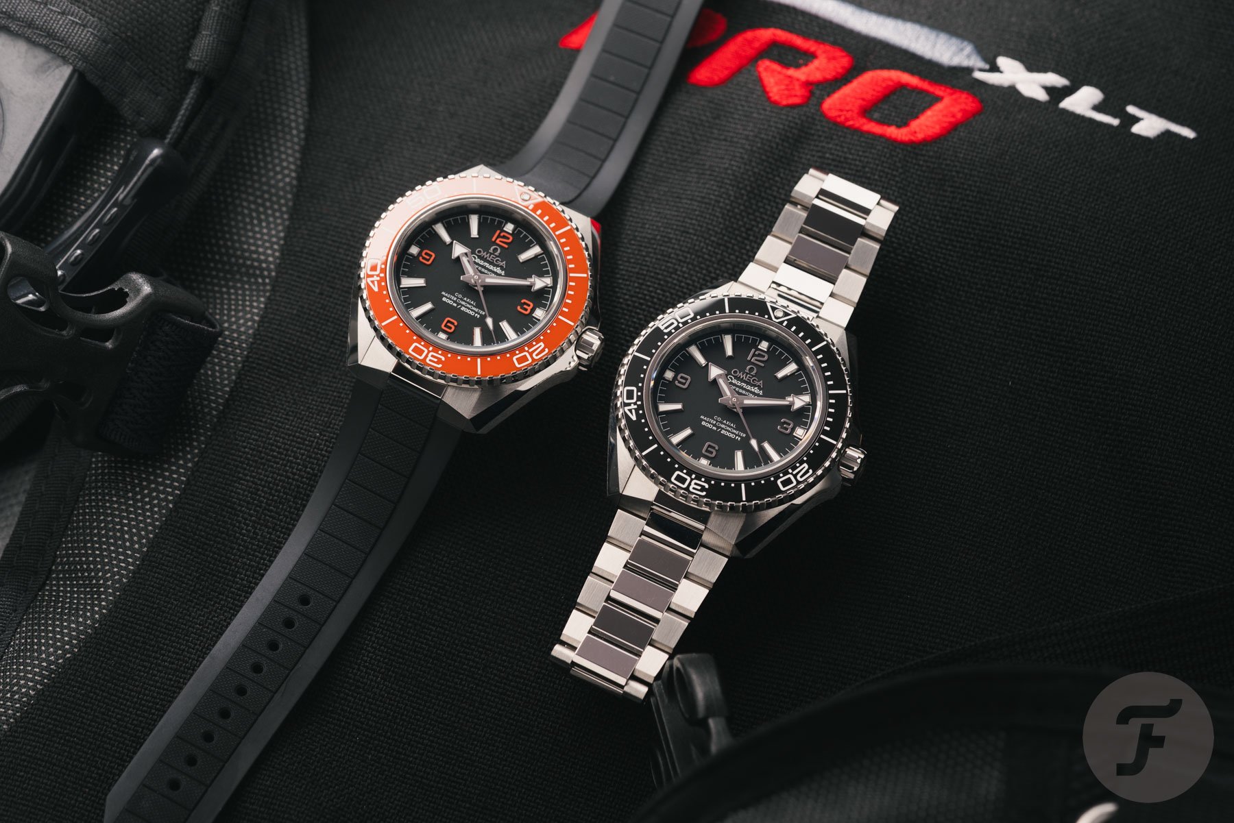 fourth-gen Omega Seamaster Planet Ocean 600M models side by side, flat-lay