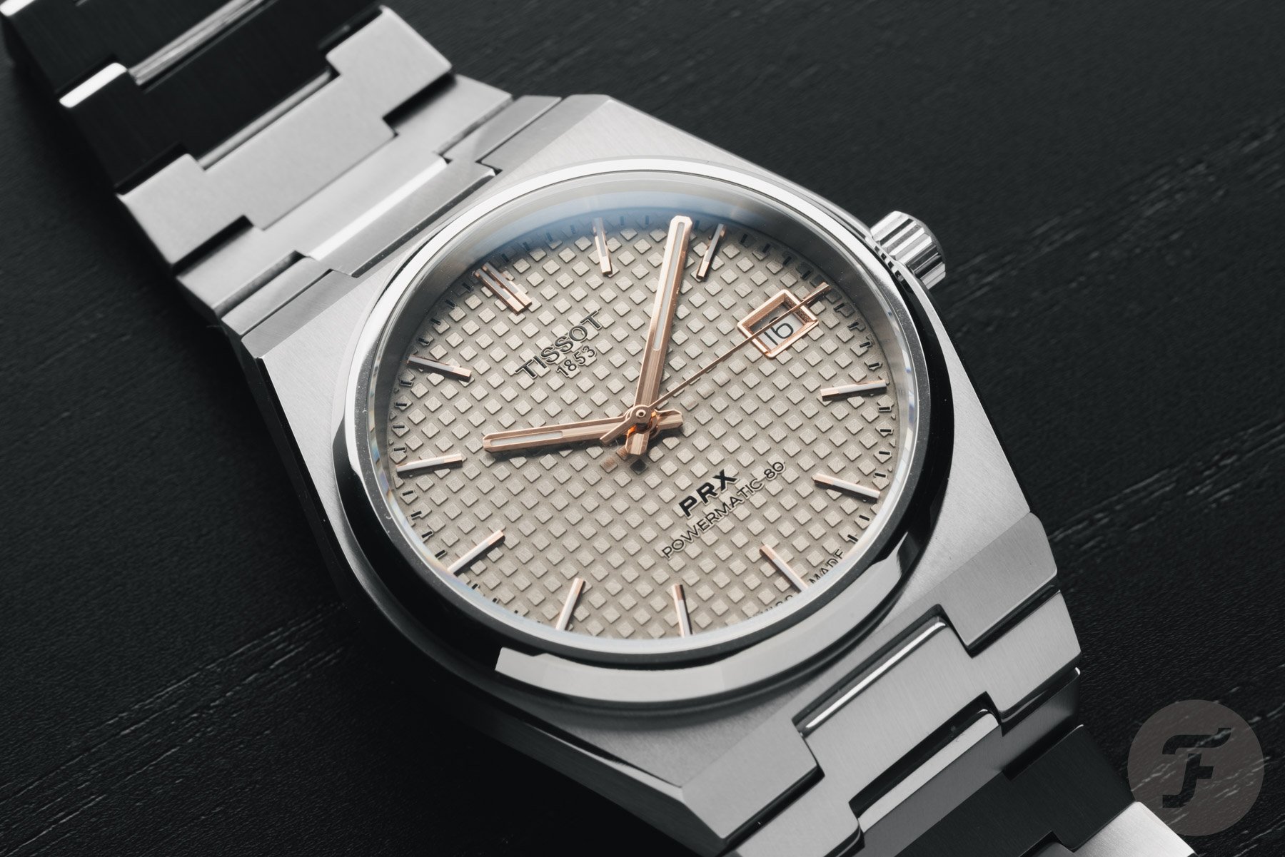 Tissot PRX Titanium 38mm close-up flat-lay