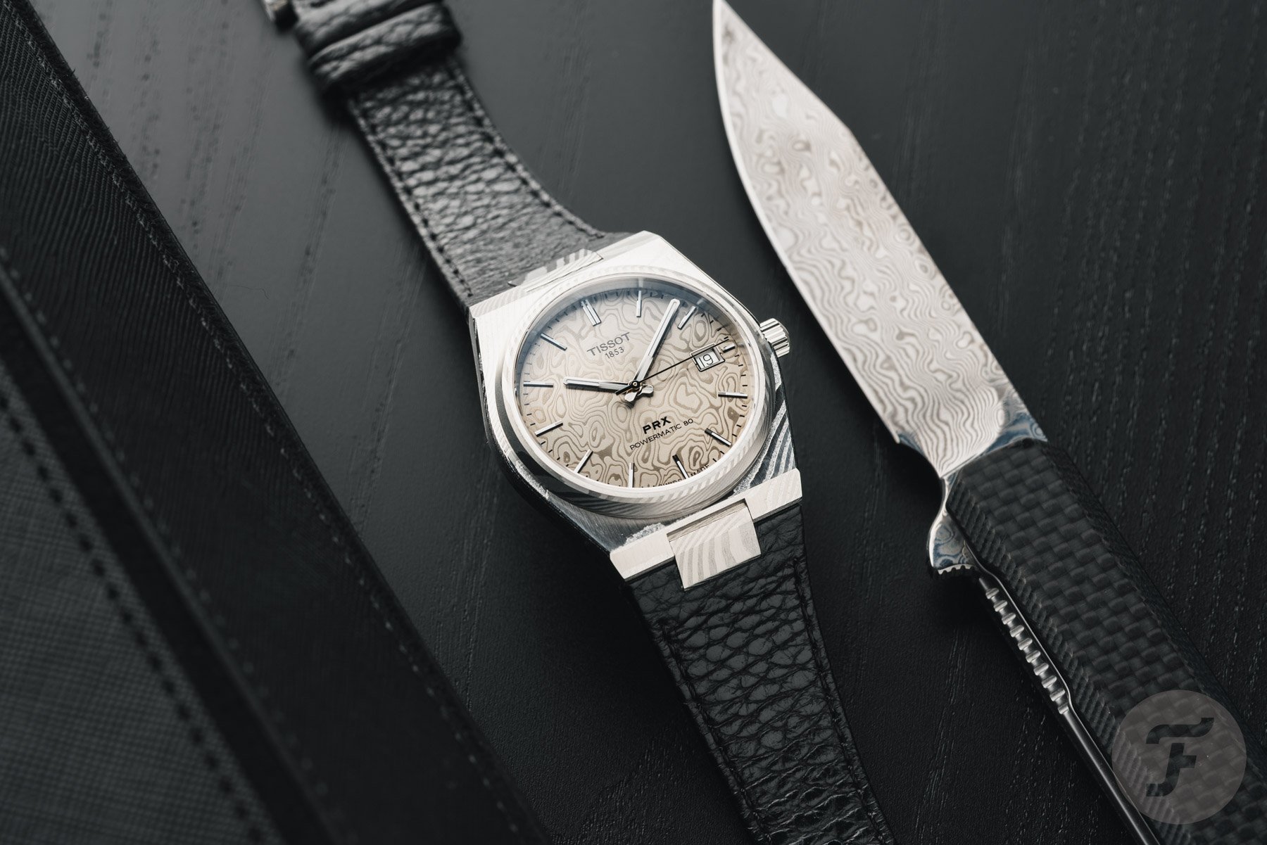 Tissot PRX Damascus Steel 38mm flat-lay with Damascus steel knife