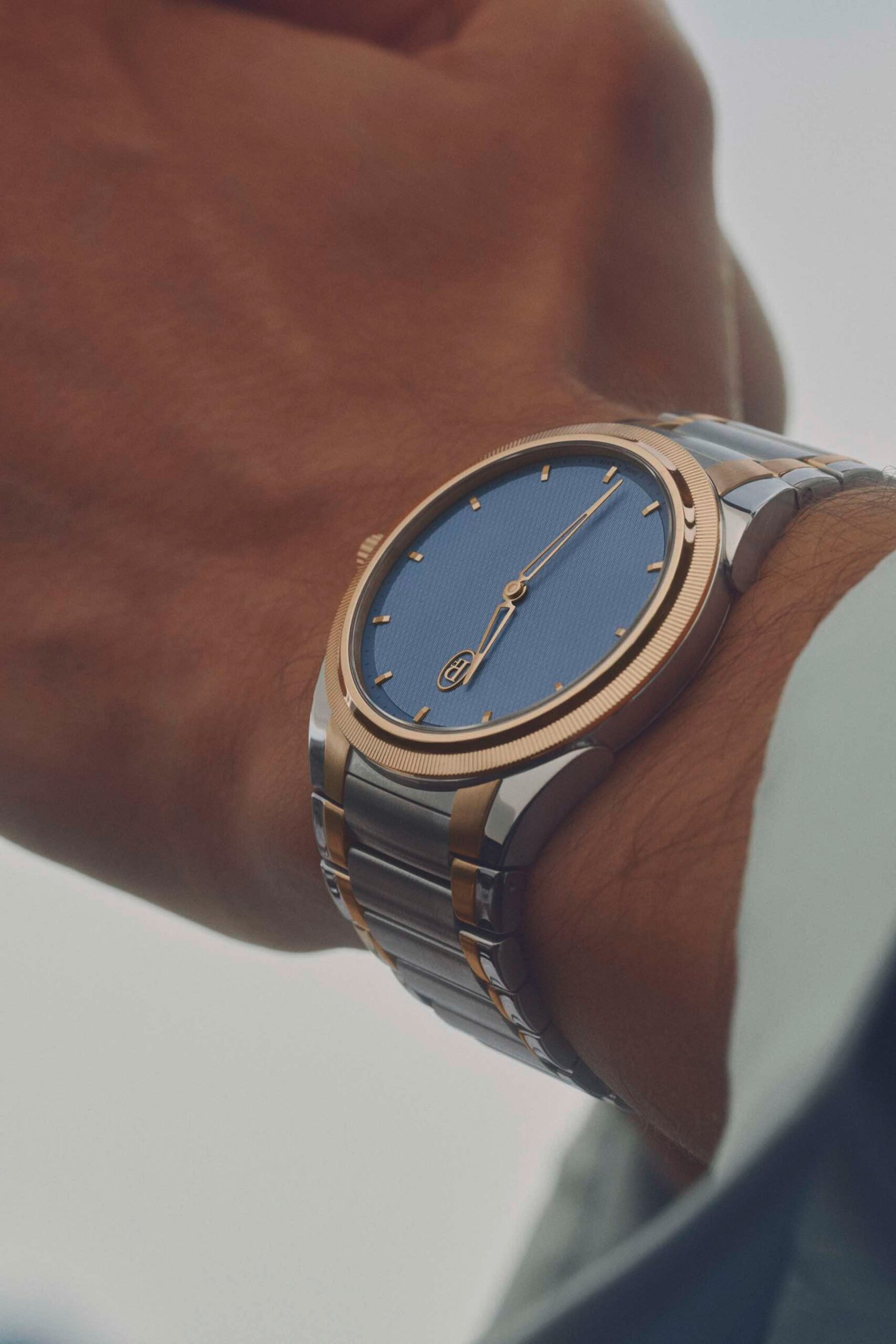 Parmigiani Fleurier Tonda PF Micro-Rotor in steel, rose gold, and stone blue, on-wrist profile shot