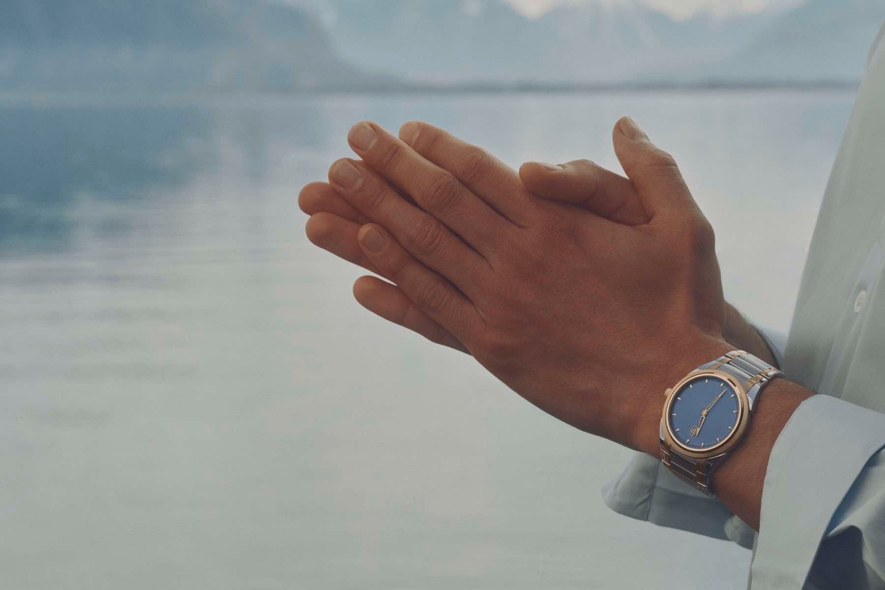 Parmigiani Fleurier Tonda PF Micro-Rotor in steel, rose gold, and stone blue on the wrist, lifestyle shot near a lake