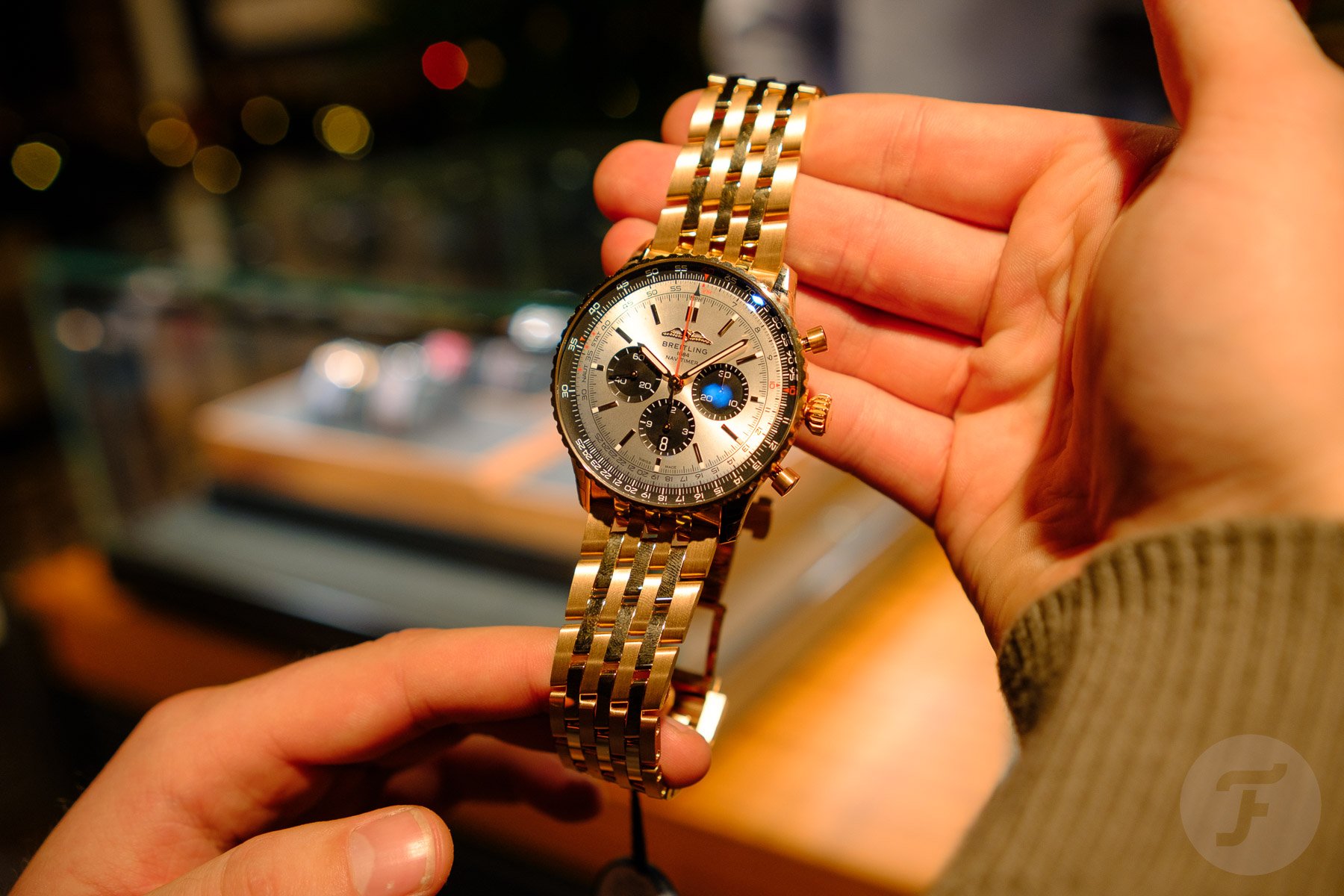 gold Breitling Navitimer B01 46 in hands