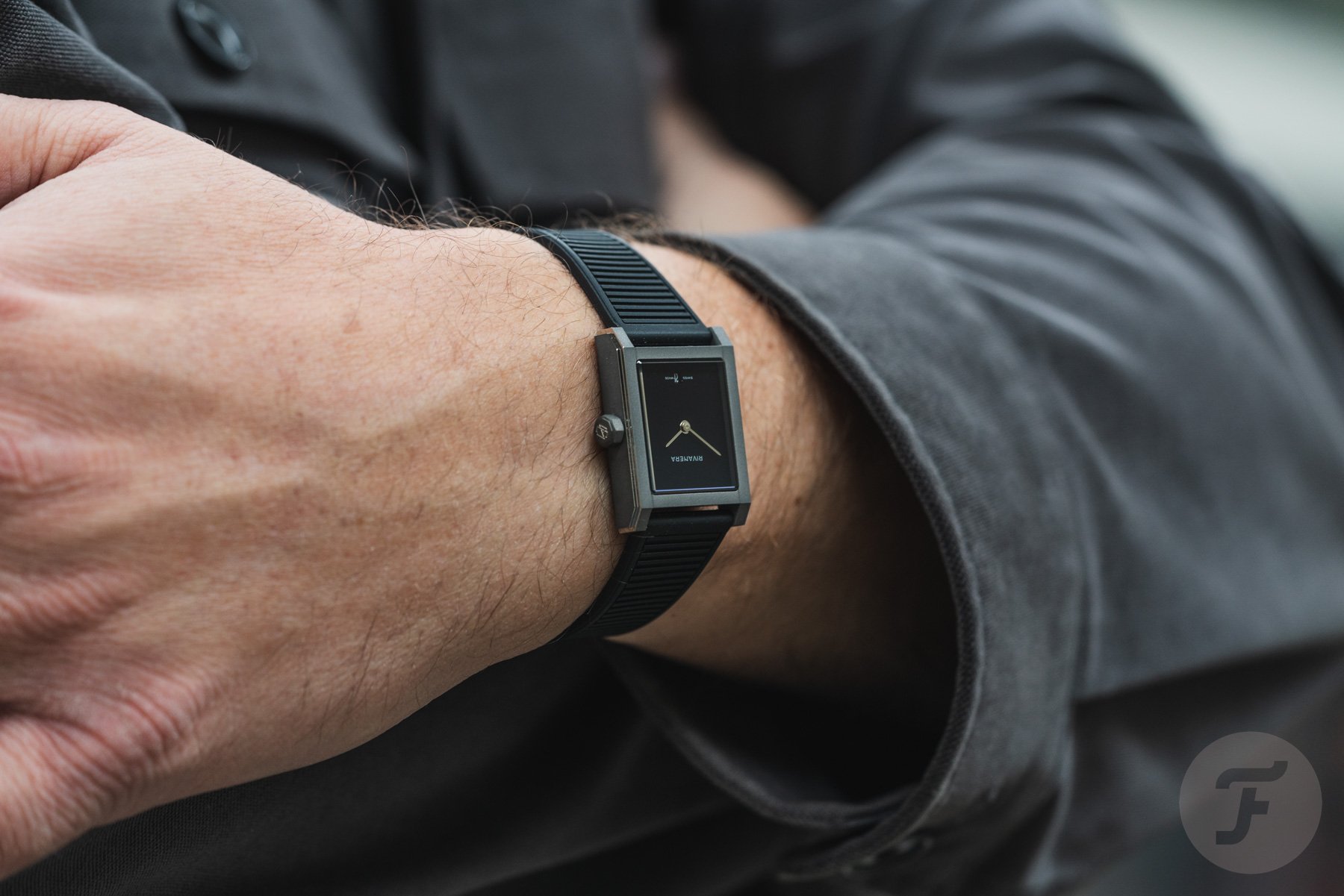 Echo/Neutra Rivanera Piccolo MB on wrist, arms crossed