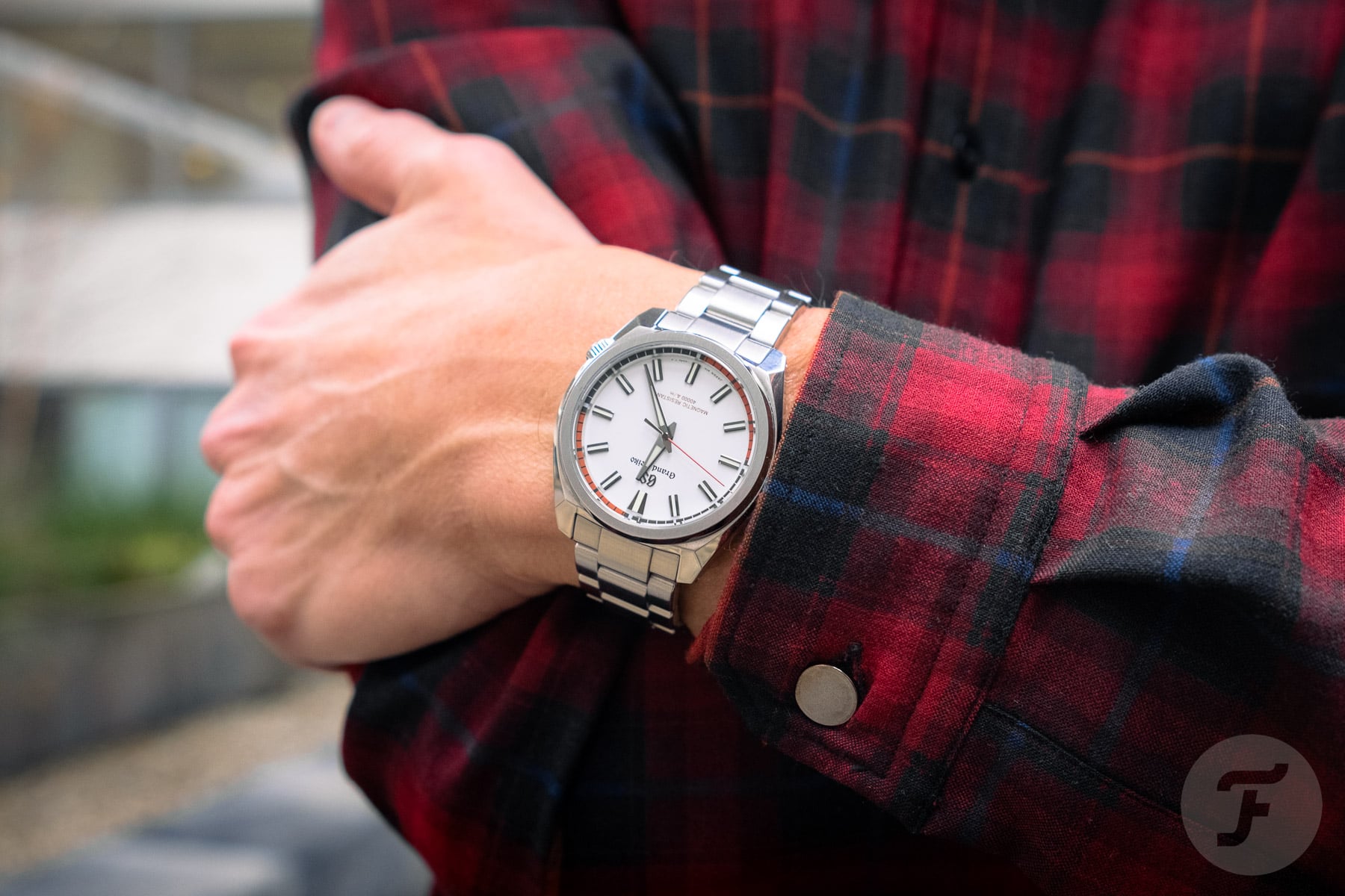 Grand Seiko SBGX341 on wrist, arms crossed