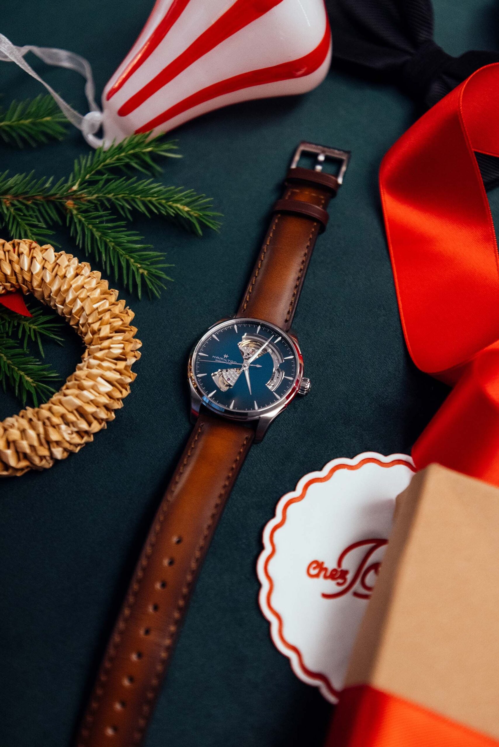 Hamilton Jazzmaster Open Heart holiday flat-lay