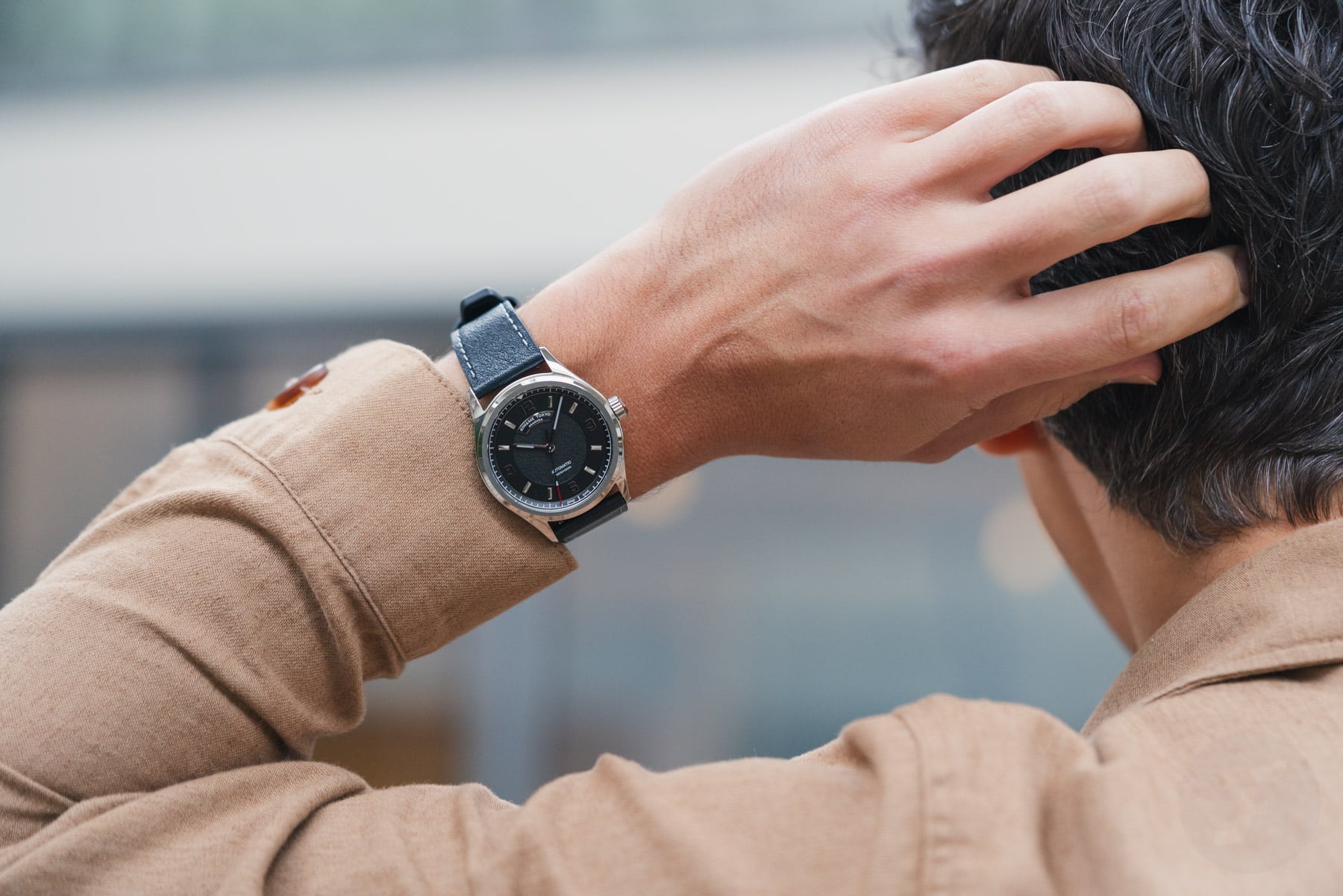 Kiwame Tokyo Iwao Sumi on wrist, hand behind head