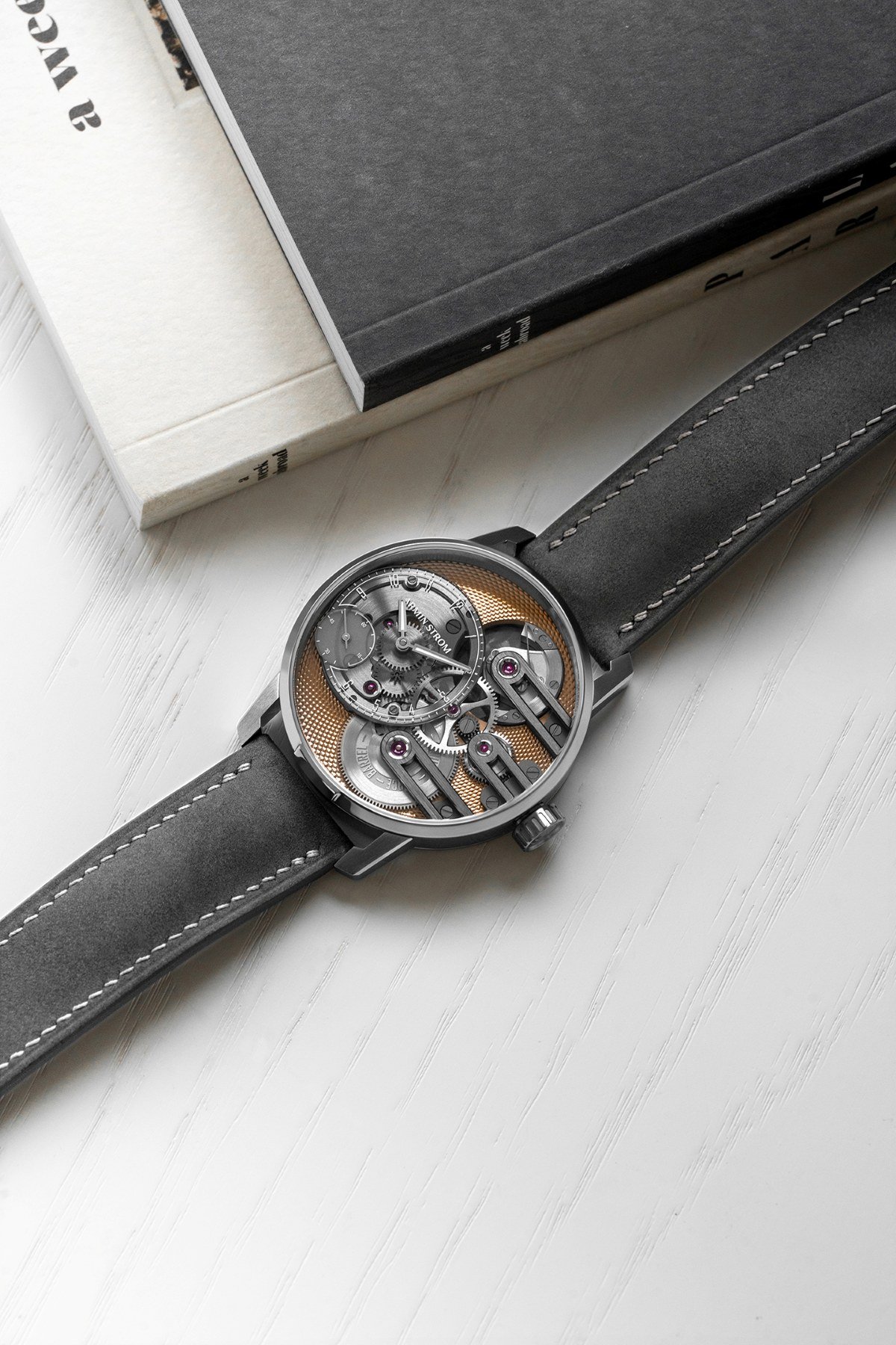 Flat-lay of the Armin Strom Gravity Equal Force Ultimate Sapphire Salmon