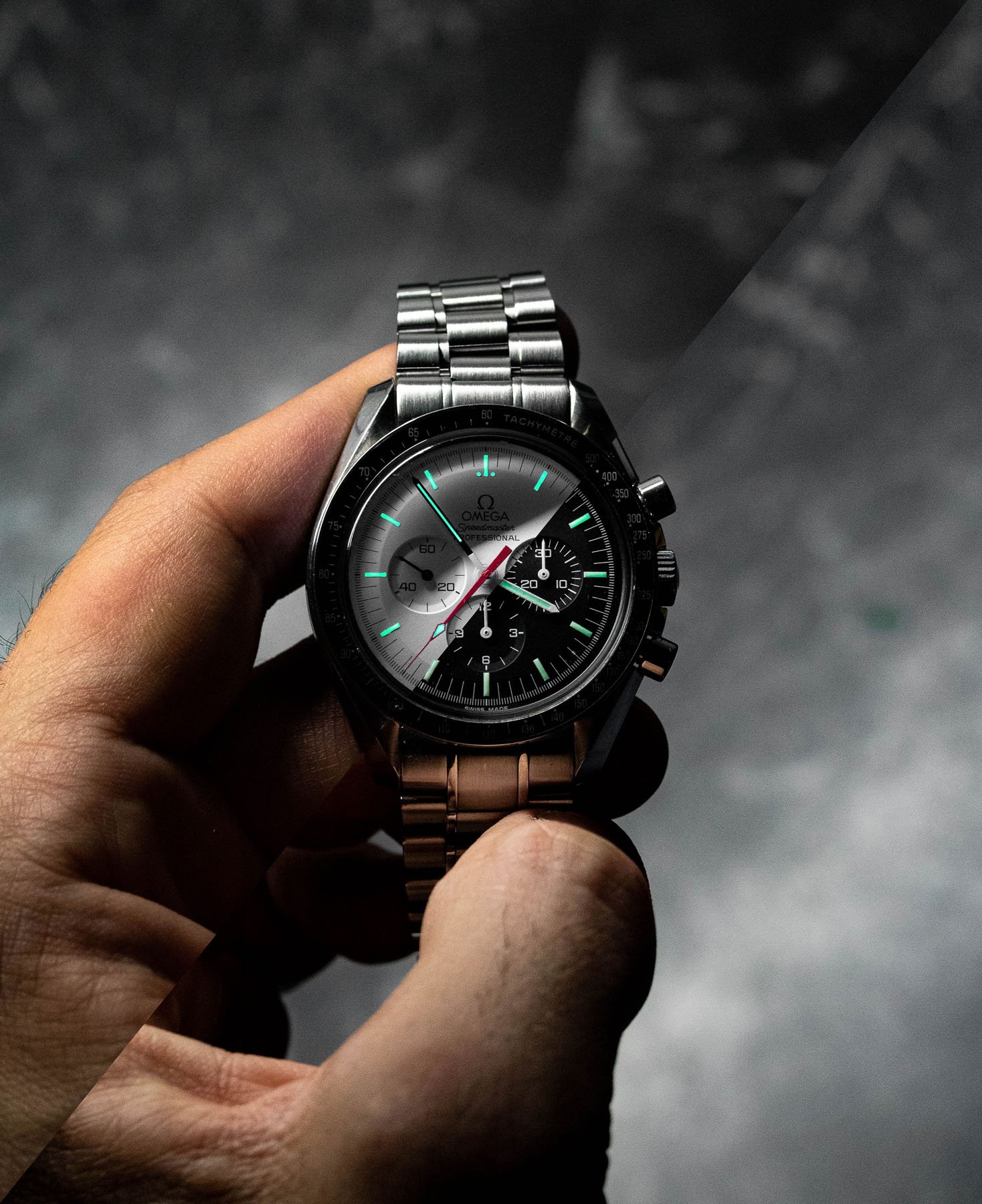 half-and-half edit of Omega Speedmaster Professional Alaska Project LE and Moonwatch in hand