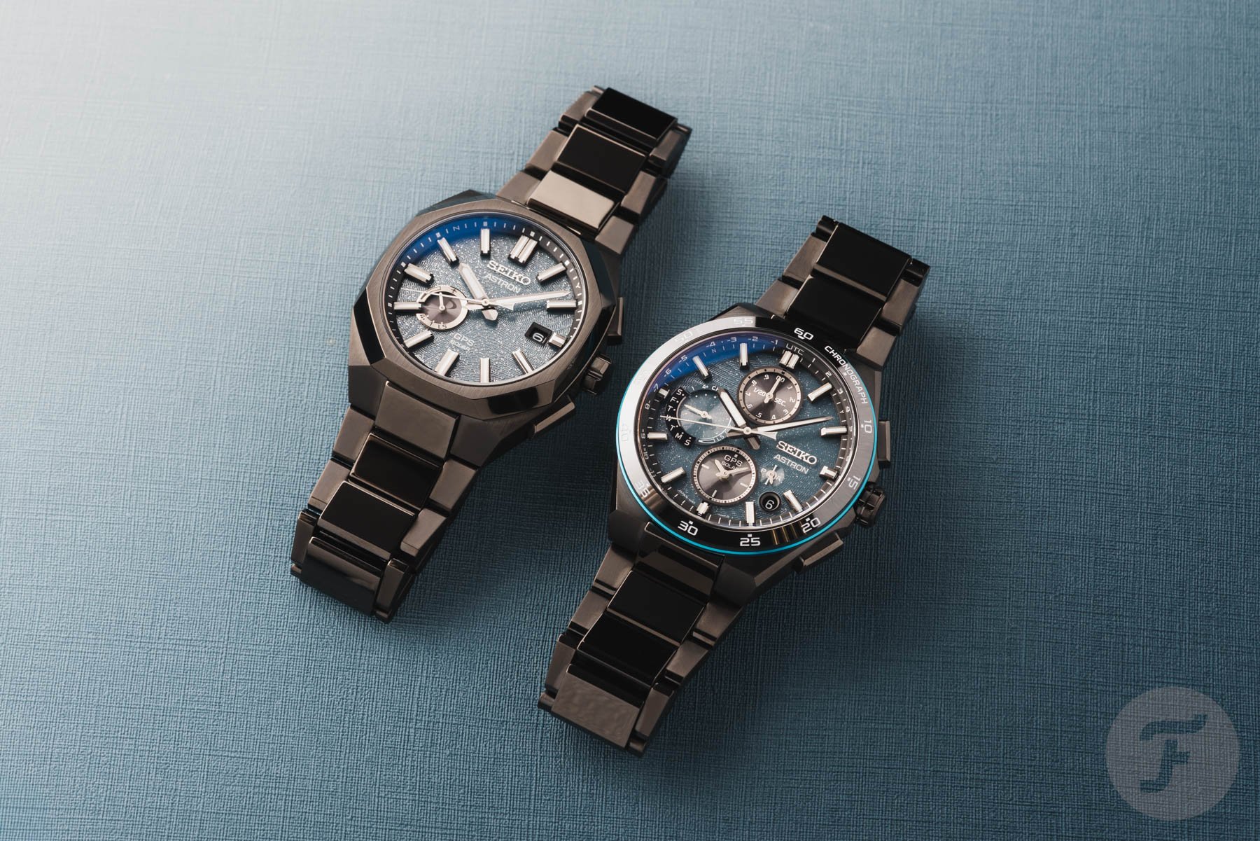 Seiko Astron SSH187 and SSJ039 side by side on a teal background