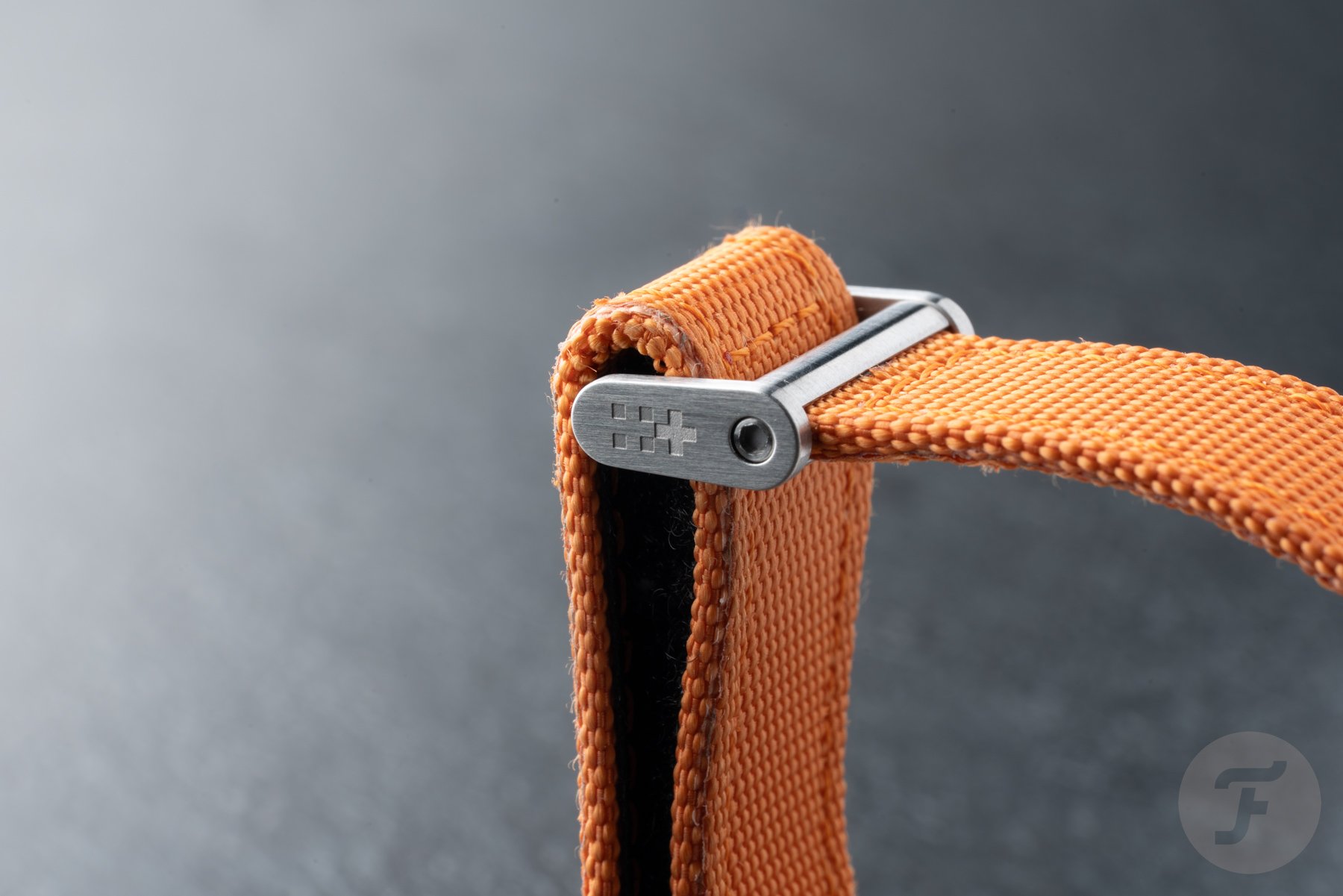 orange V-Strap of Christopher Ward C63 Sealander Extreme GMT