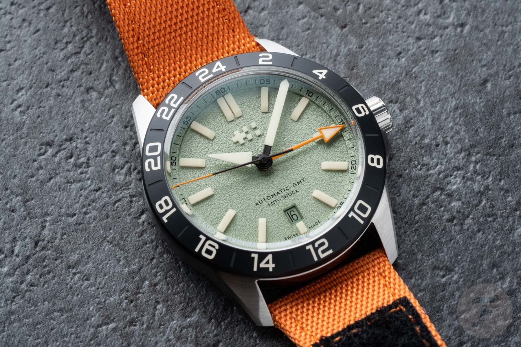 green--dial Christopher Ward C63 Sealander Extreme GMT flat-lay, up close