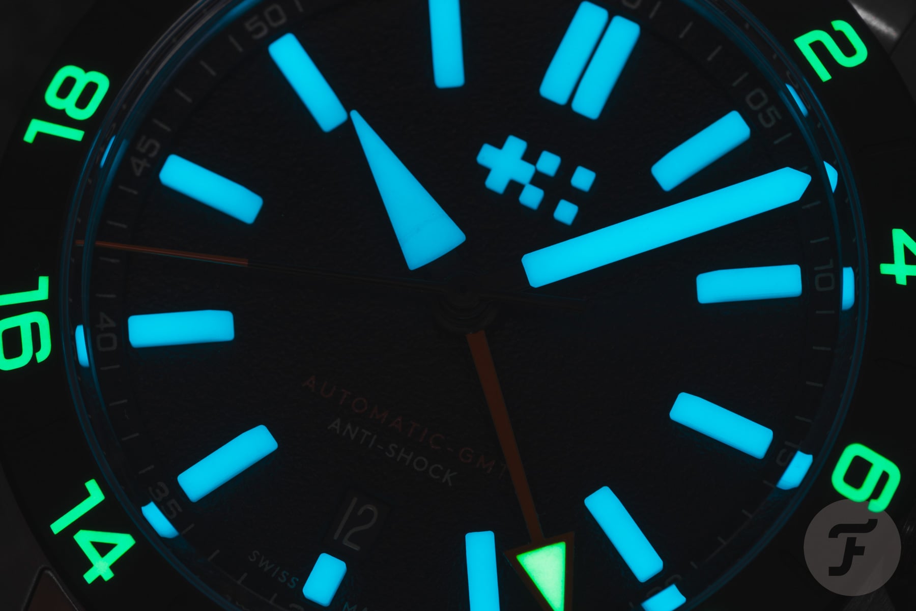 black-dial Christopher Ward C63 Sealander Extreme GMT up-close lume shot