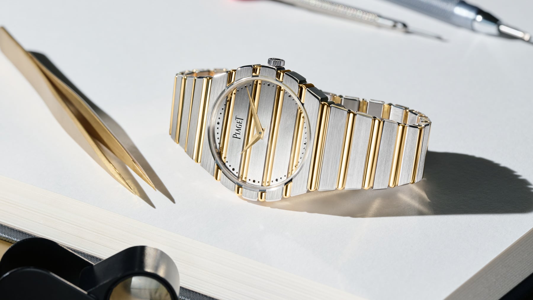 two-tone Piaget Polo 79 on side, crown up