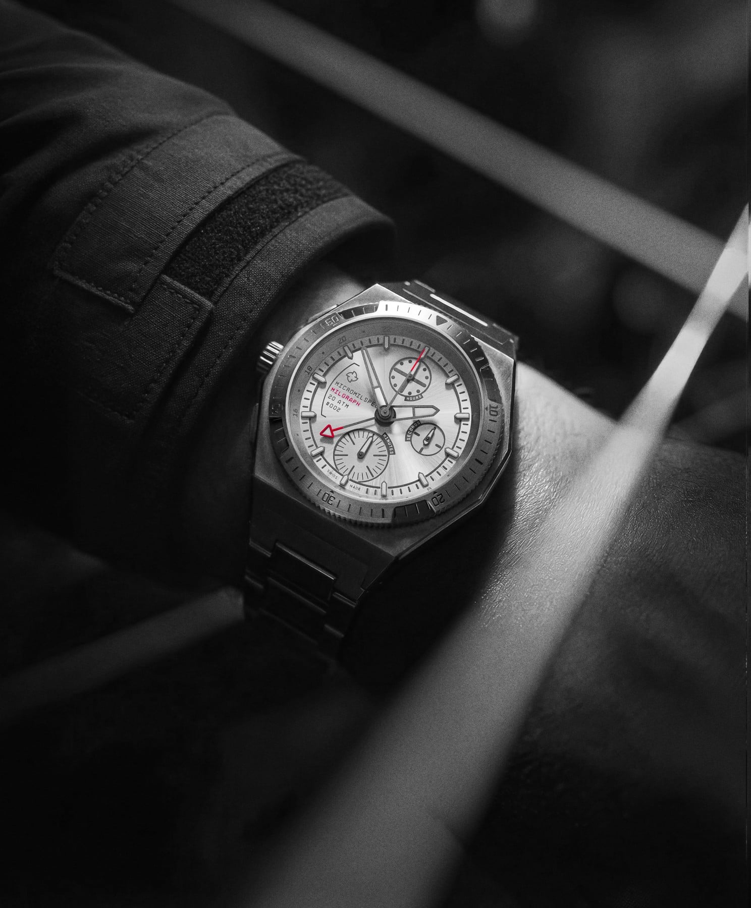 Wrist shot of the Micromilspec Milgraph T5 on a titanium bracelet