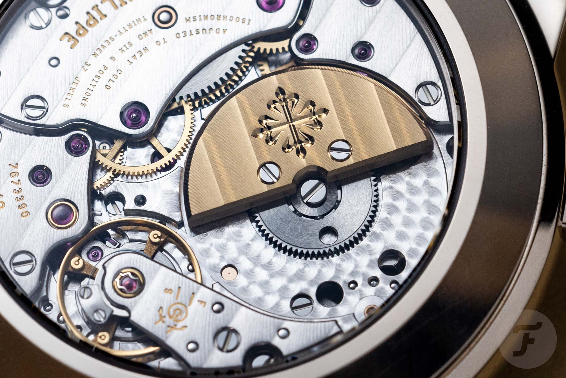 in-house micro-rotor 240 HU C movement inside Patek Philippe World Time With Date 5330G-001