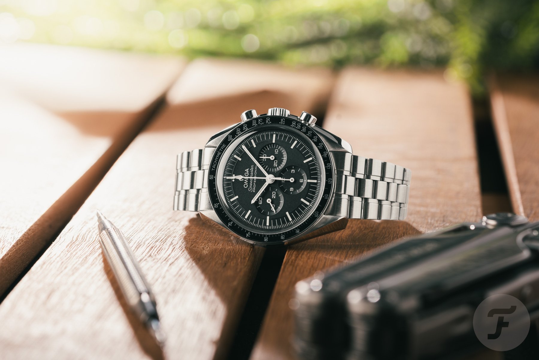Omega Speedmaster Professional Moonwatch 310.30.42.50.01.001 on its side, crown up