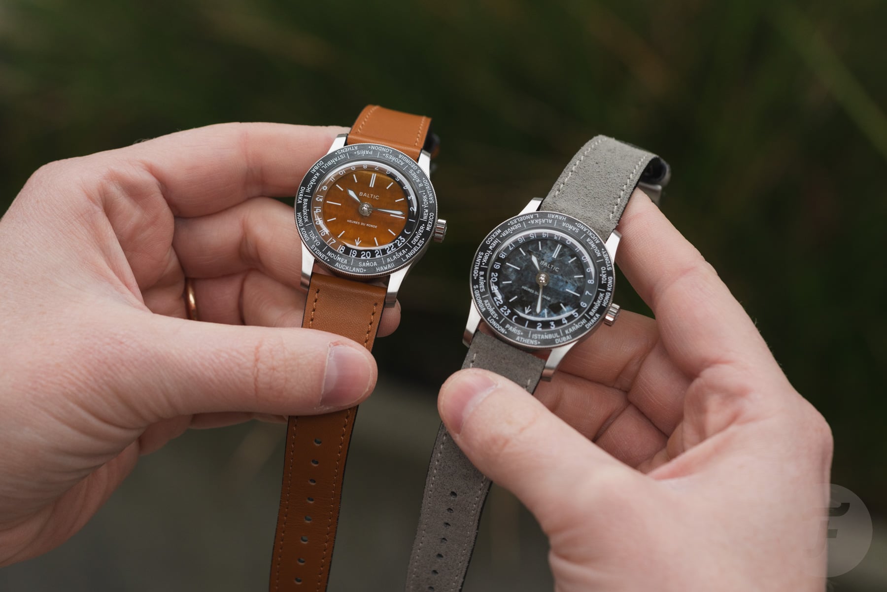 Baltic Heures du Monde tiger eye and labradorite models in hands