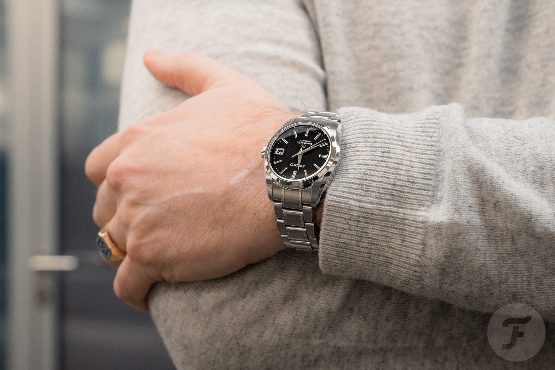Grand Seiko SBGR023 on wrist, arms crossed
