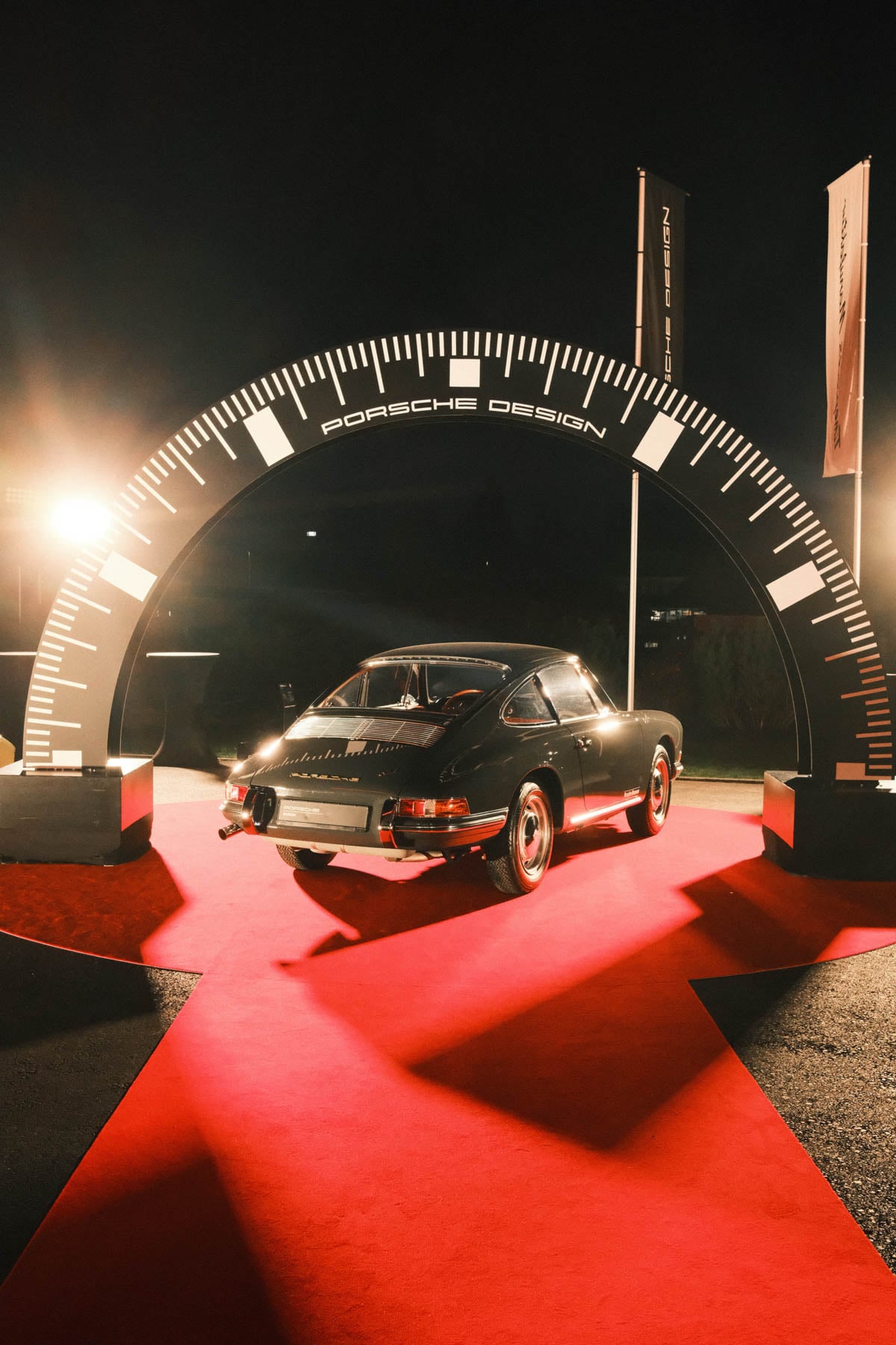 old Porsche 911 in front of Porsche Design Timepieces Manufaktur facility