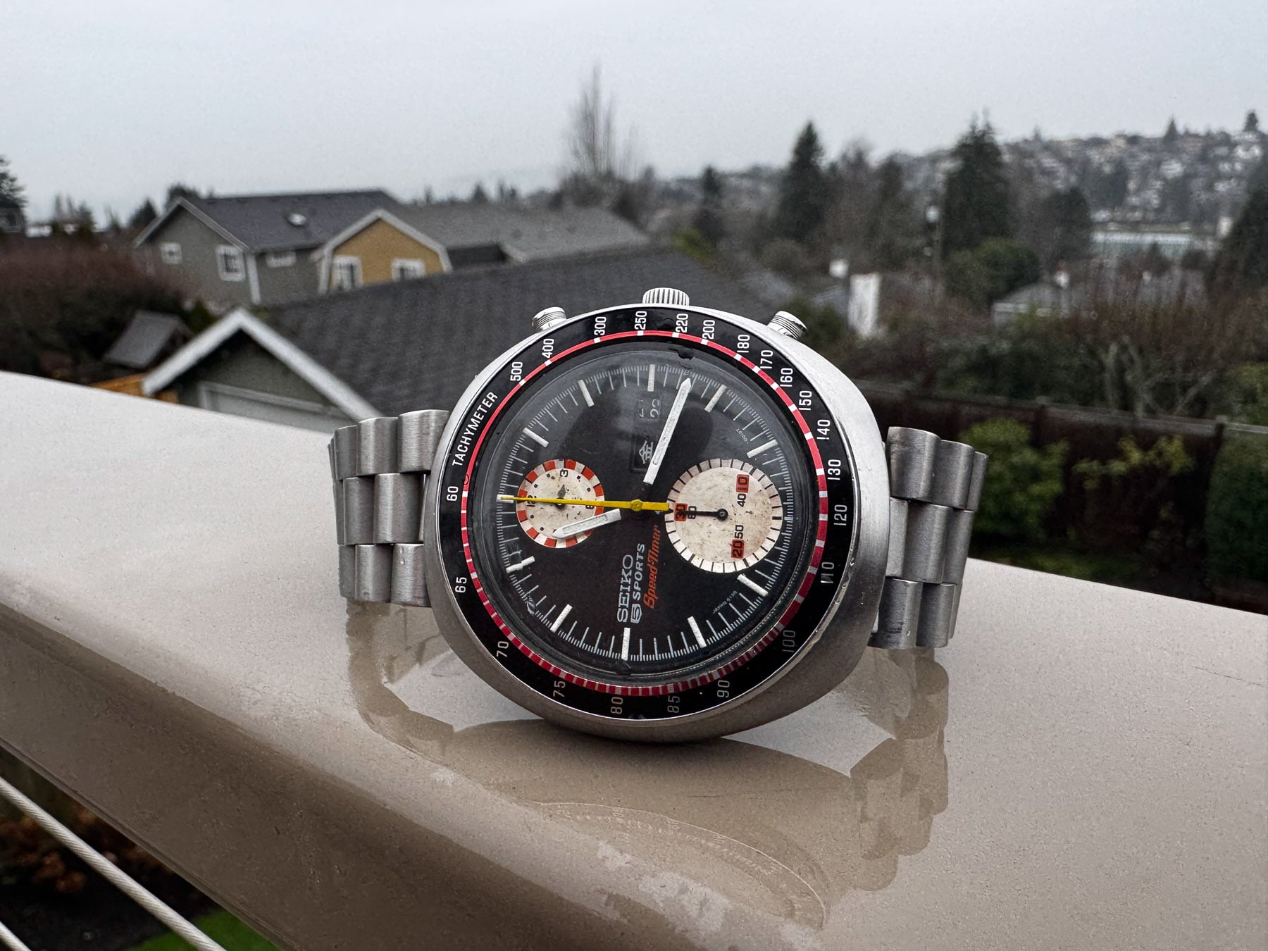 Seiko "UFO" 6138-001X on its side, crown up, on railing