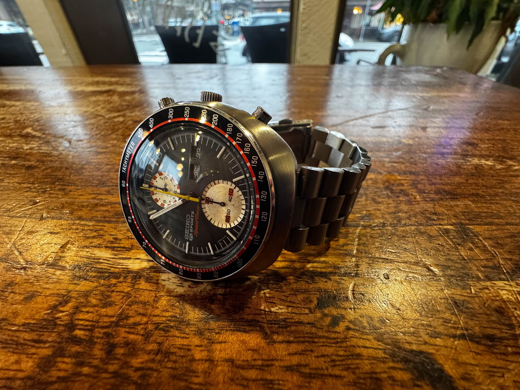 Seiko "UFO" 6138-001X on its side, crown up, on table