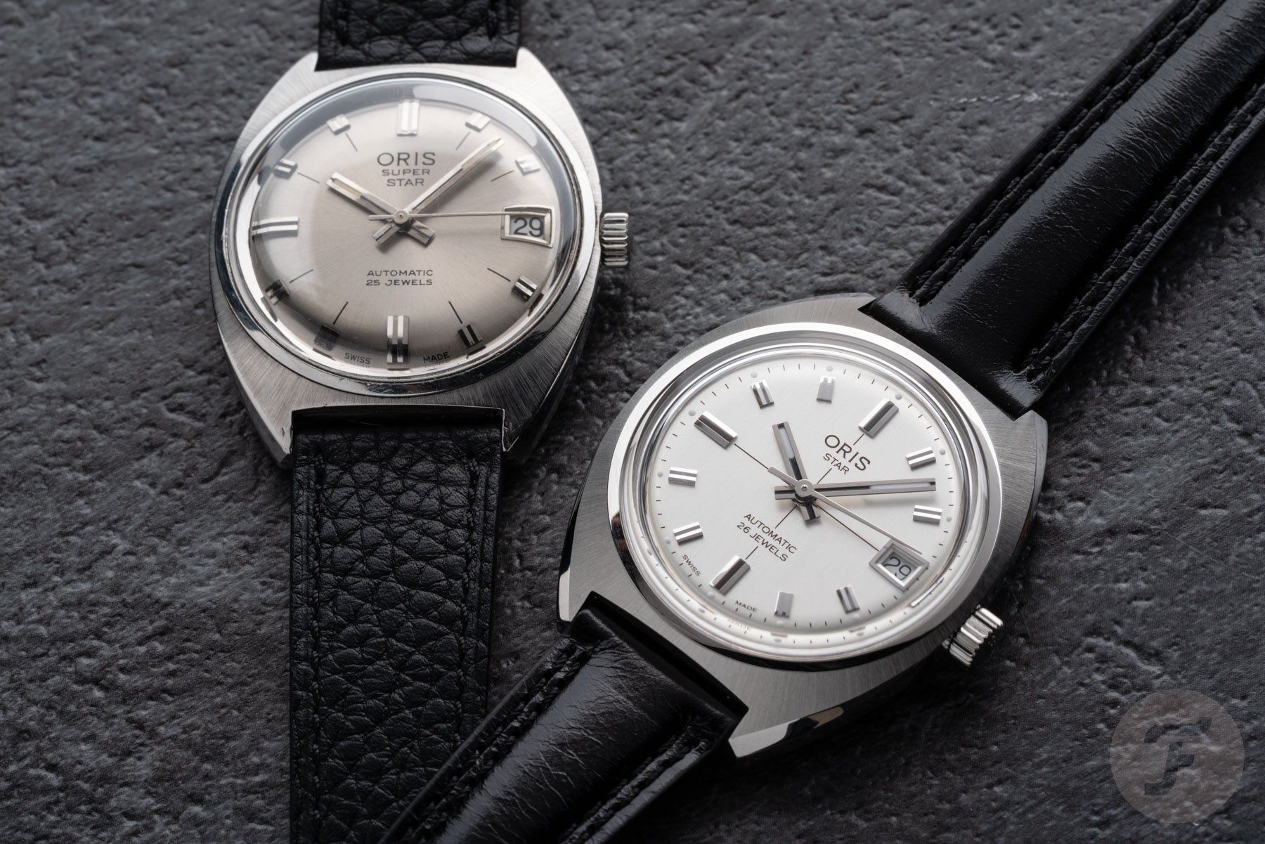 Oris Star re-edition next to 1960s original, flat-lay