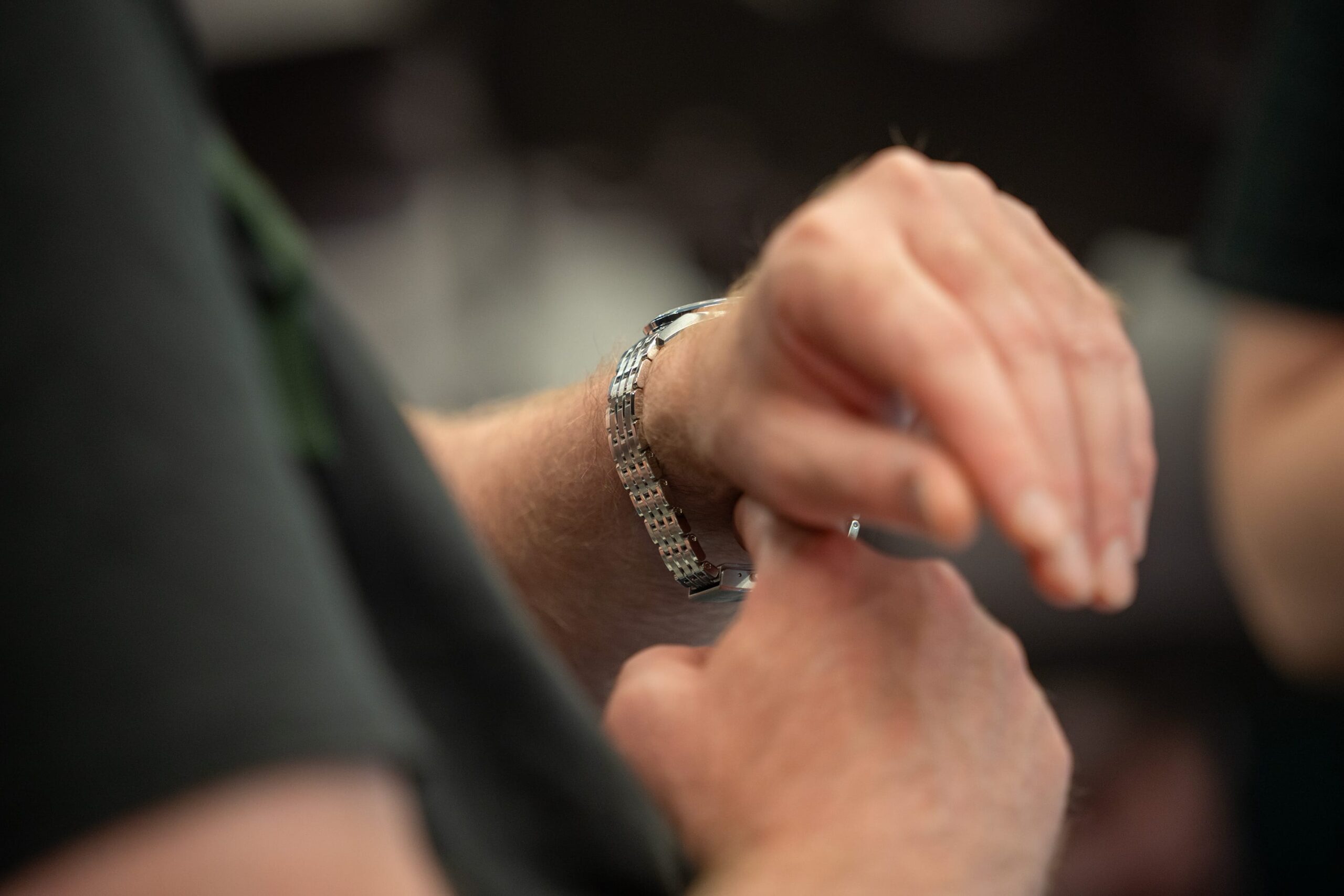 man trying on a watch at WatchIt! watch fair