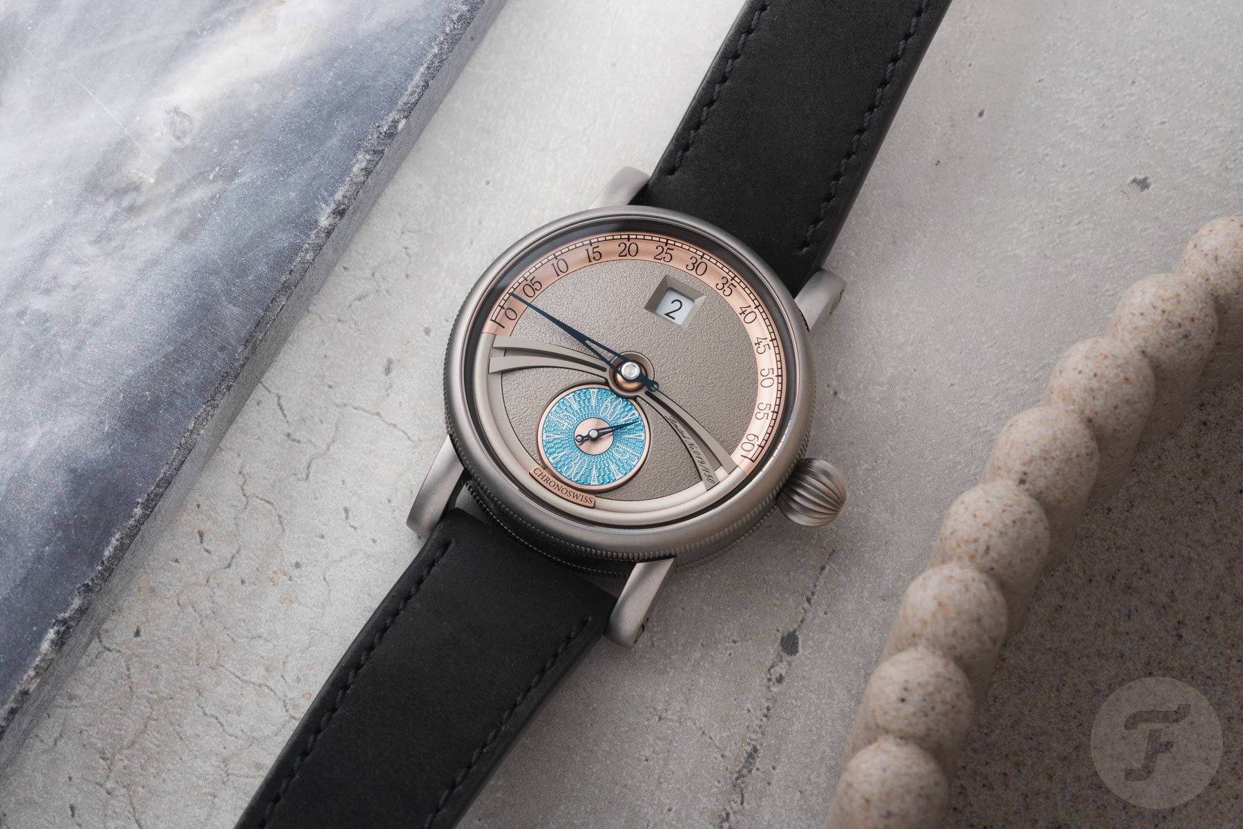 Flat-lay of the Chronoswiss Delphis Art Deco