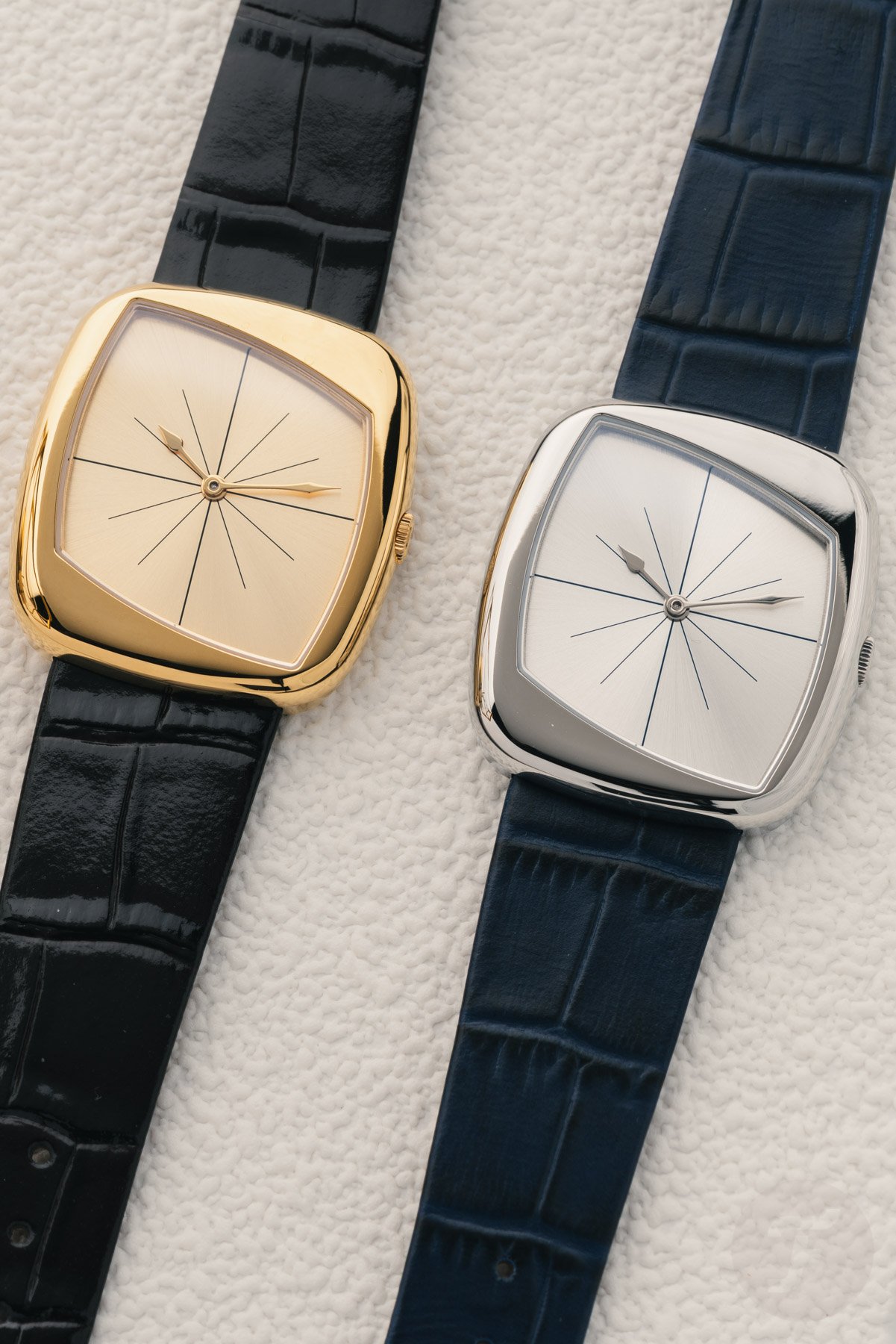 steel and gold PVD Dennison + Collectability Oblique Vector models side by side, flat-lay