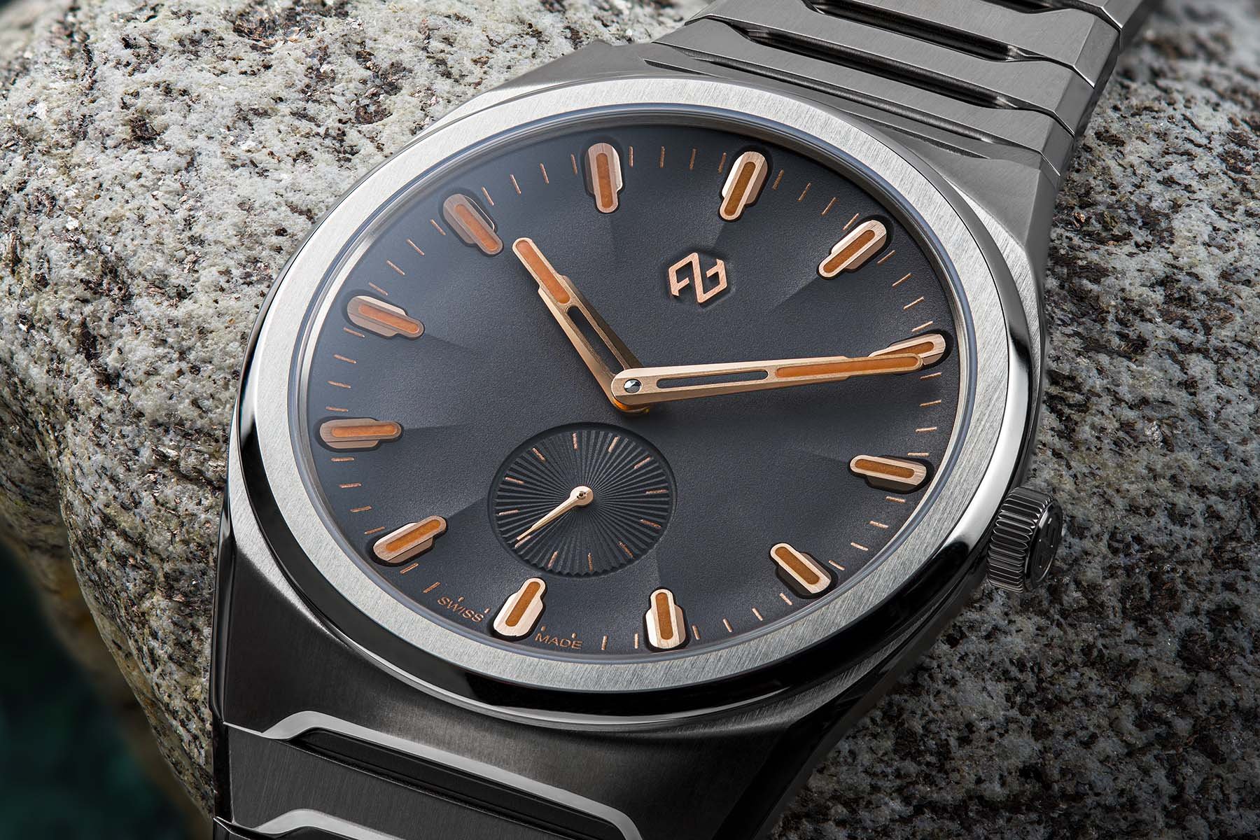 gray-dial Formex Aria Manufacture Chronometer up close, draped over rock