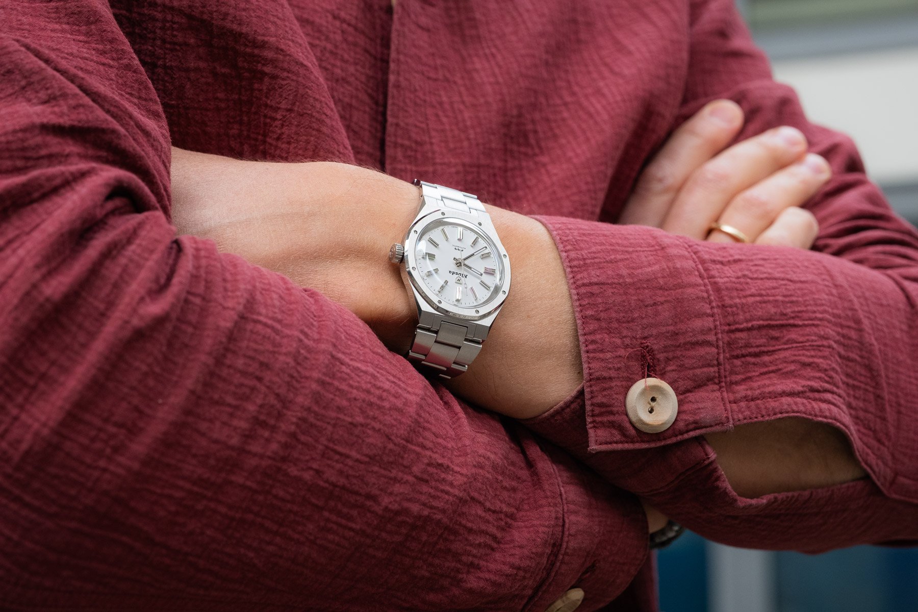 Nivada Grenchen × Le Petit Poussoir F77 Polar White MK1 on wrist, arms crossed