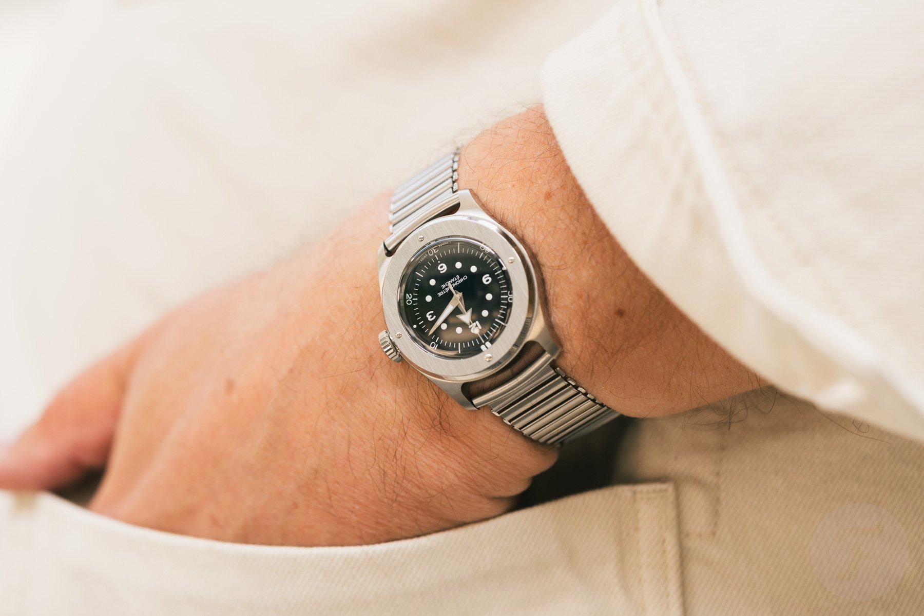 black-dial Serica 7505 hand halfway in pocket