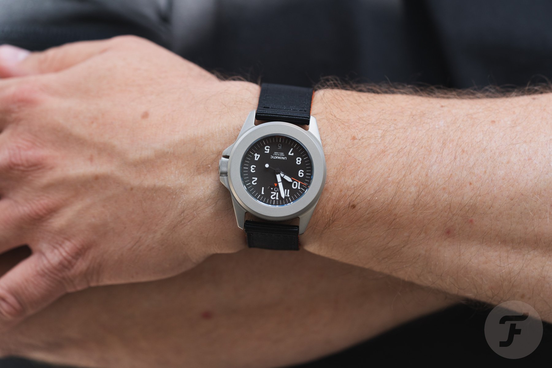 Unimatic Modell Quattro UT4-U-TI-GMT on wrist, arms crossed