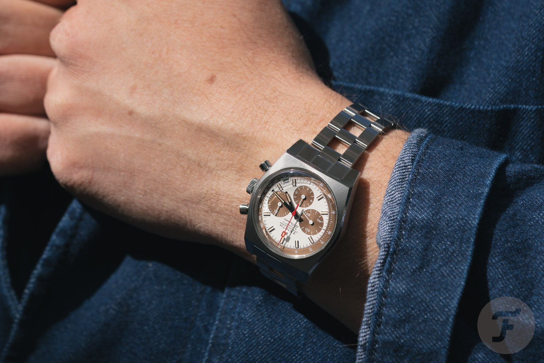 Zenith Chronomaster Revival A384 Tropical on wrist, hands on lapel