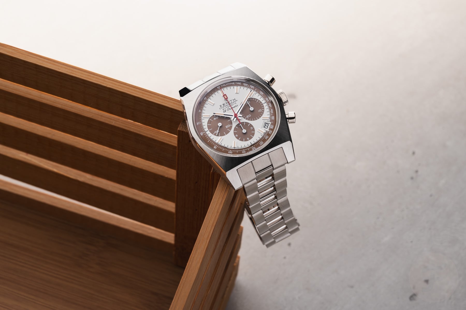 summer watches — Zenith Chronomaster Revival A384 Tropical hanging off of wooden crate