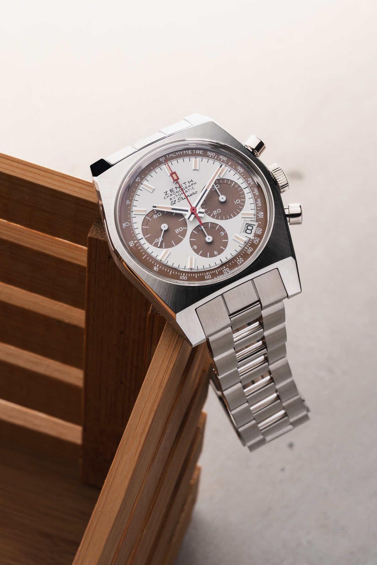 Zenith Chronomaster Revival A384 Tropical hanging off of wooden crate
