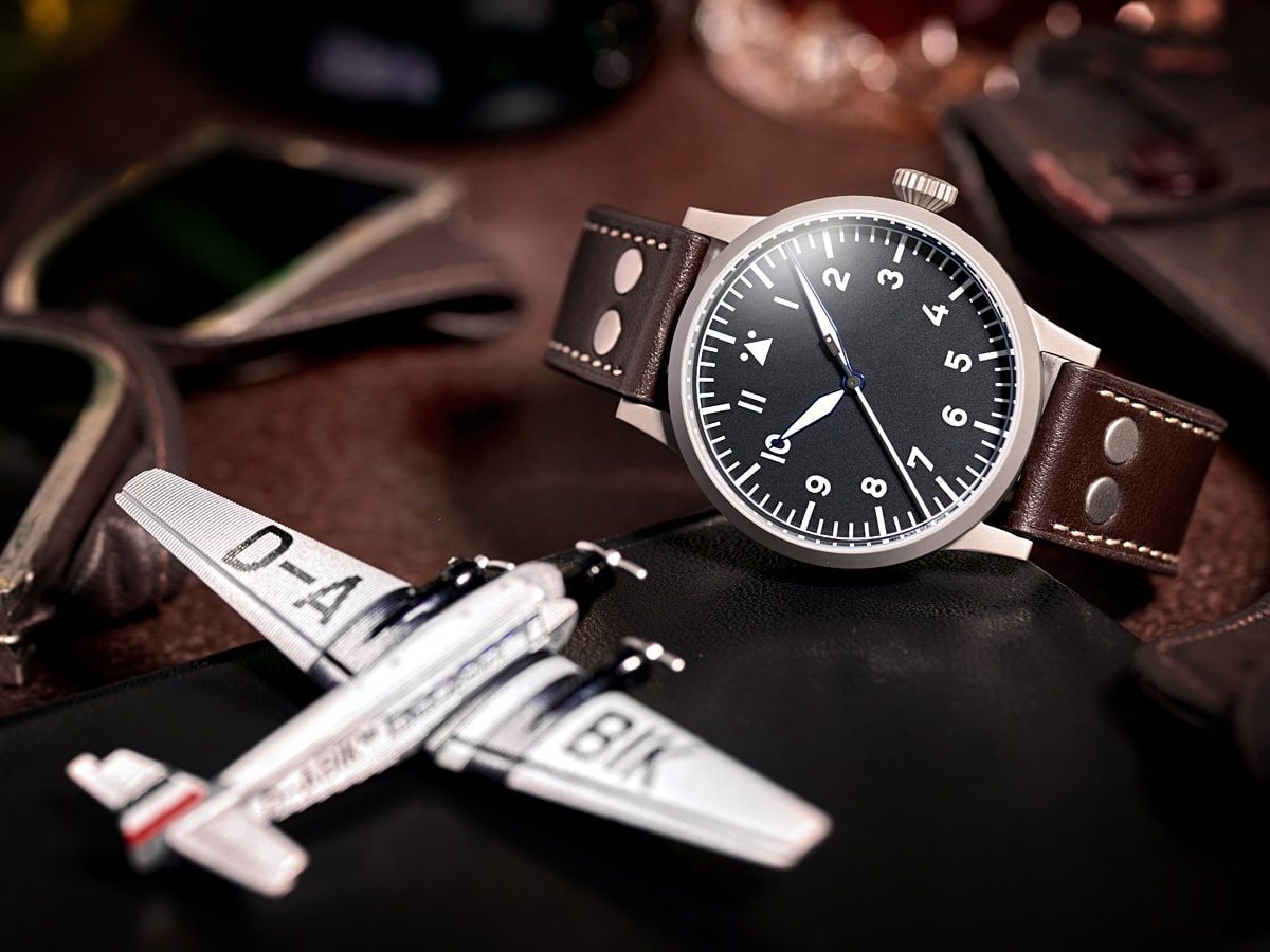 IWC Big Pilot's Watch alternatives — Laco Pilot Watch Original Saarbrücken on its side, crown up, with mini plane prop