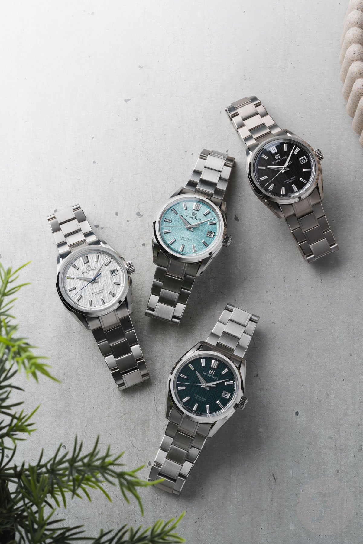Grand Seiko Evolution 9 Collection Hi-Beat 36000 SLGH029 SLGH031, SLGH033, and SLGH035 group shot, flat-lay