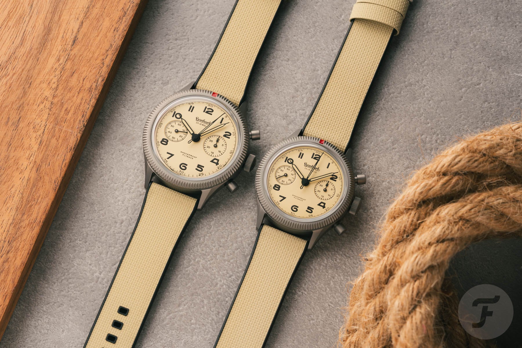 42mm and 39mm Hanhart 417 TI Desert Pilot models side by side, flat-lay