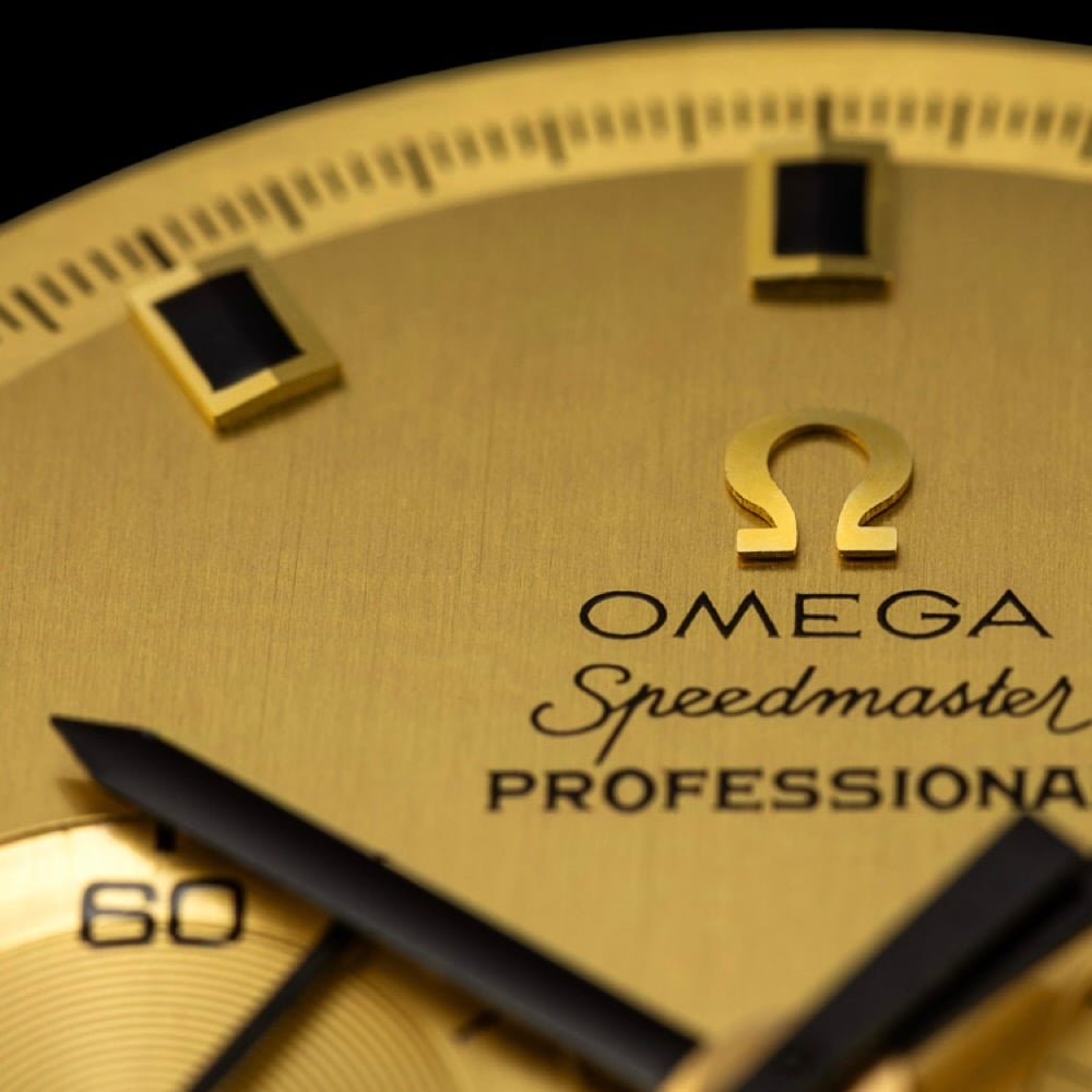 picture of gold Speedmaster dial up close in Moonwatch Dials book