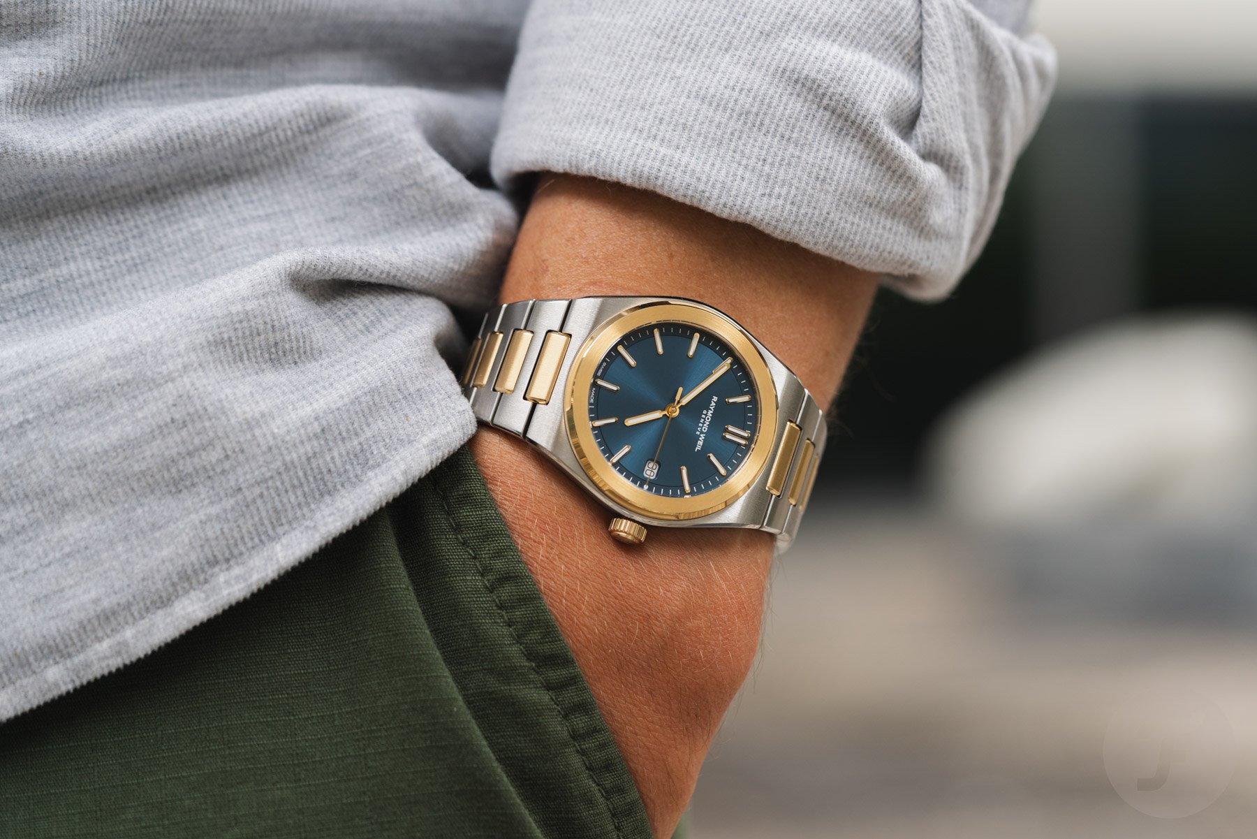 blue-dial two-tone Raymond Weil A.R.T. Date pocket shot