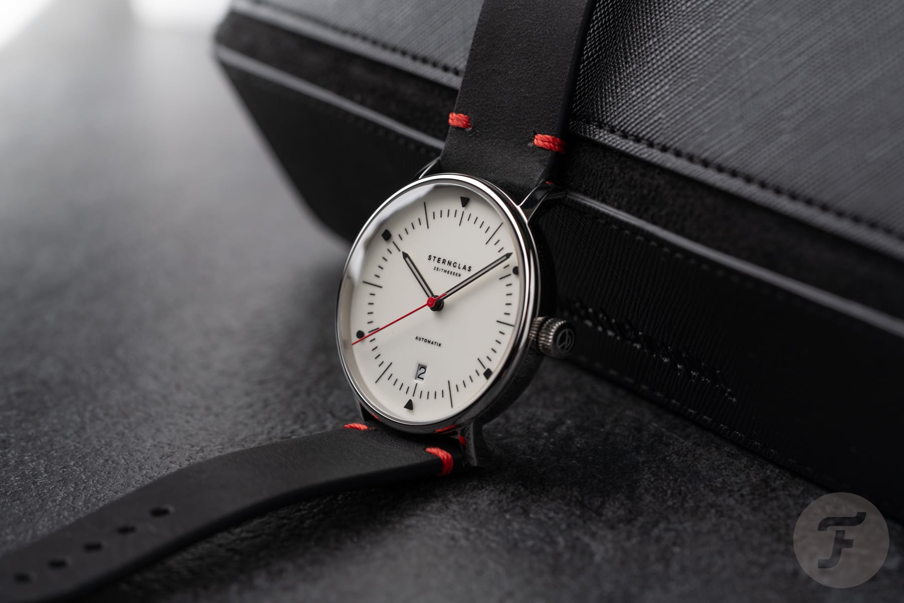Sternglas Naos Automatik Edition Bauhaus X red propped up