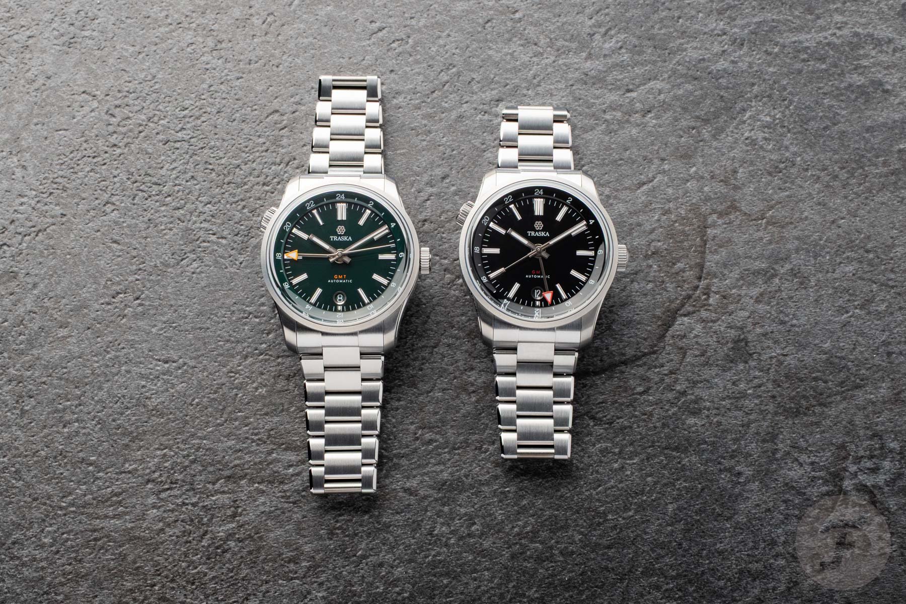 Traska Venturer GMT Bottle Green and Carbon Black head-on, flat-lay