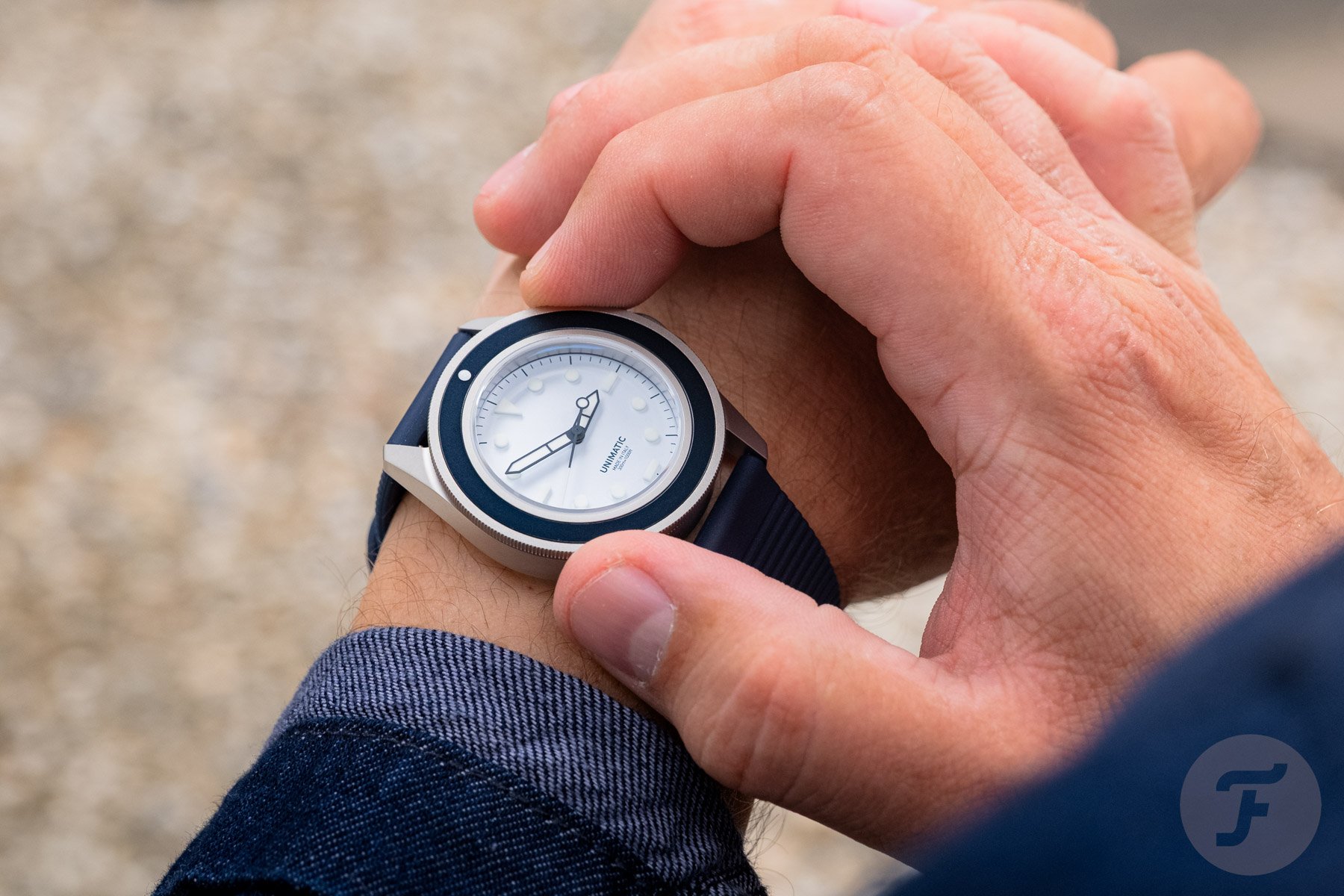 Unimatic Modello Uno UT1-IPP on wrist, hand on bezel