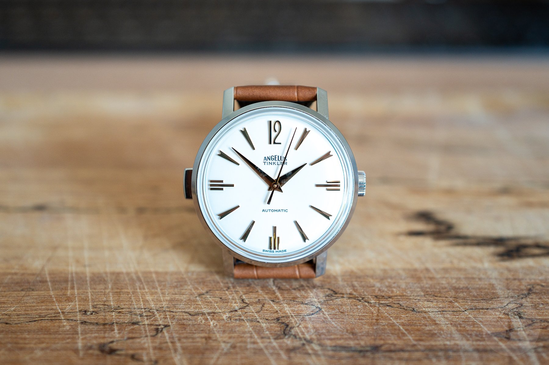 Angelus Tinkler 1958 Steel Quarter Repeater head on, propped up with strap