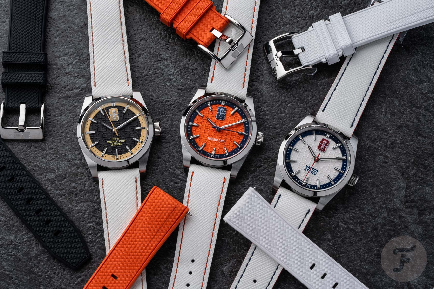 three Axia Time World Cup 2026 watches, flat-lay with extra straps