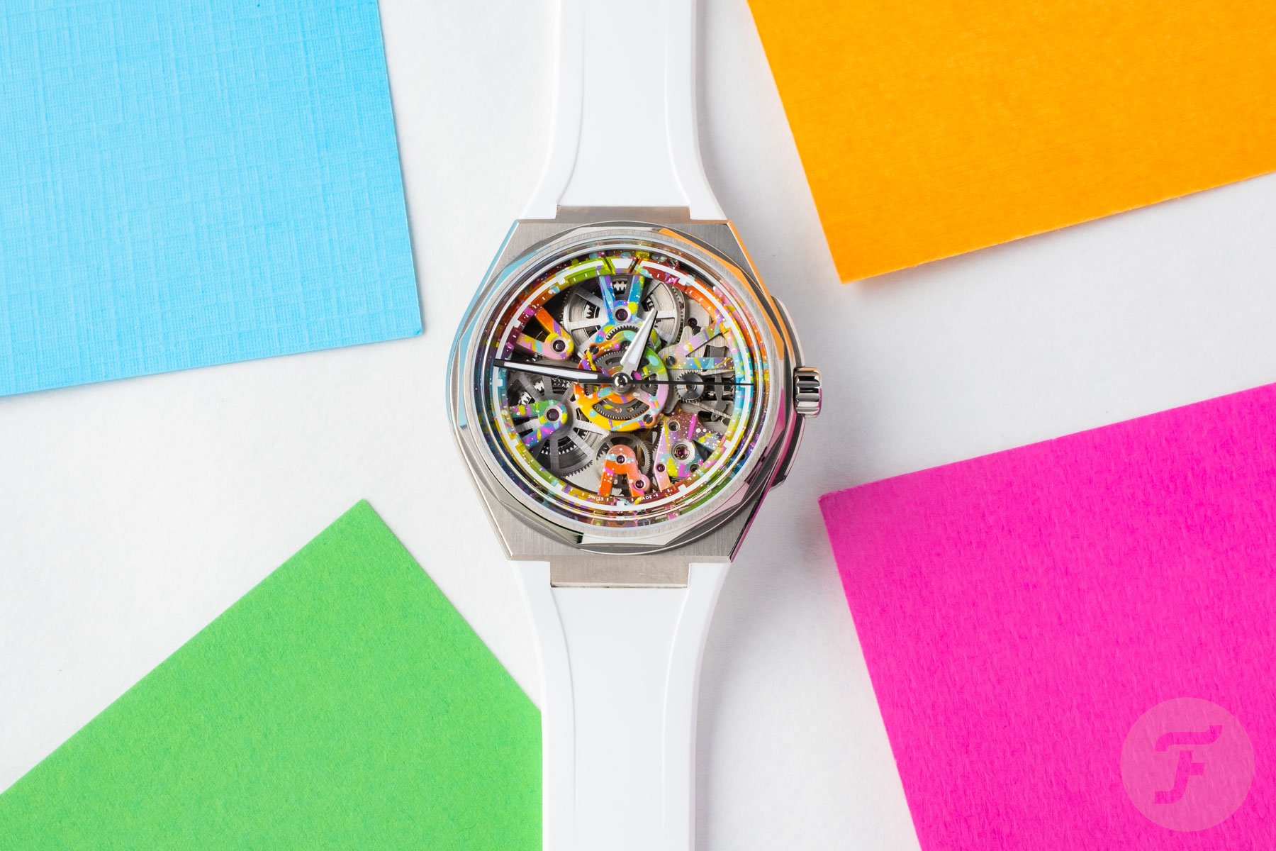 Christopher Ward Twelve Xander flat-lay with colored paper