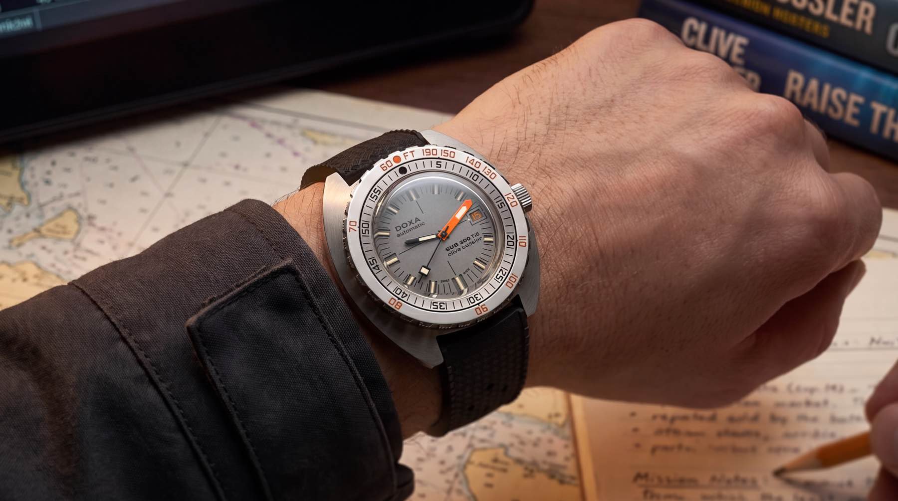 Doxa Sub 300 Ti5 Clive Cussler wrist shot over map