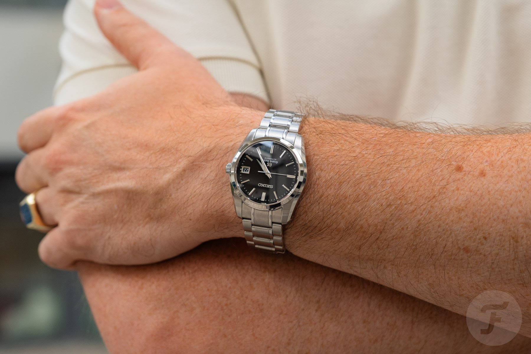 watches that won us over — Grand Seiko SBGR023 on wrist, arms crossed